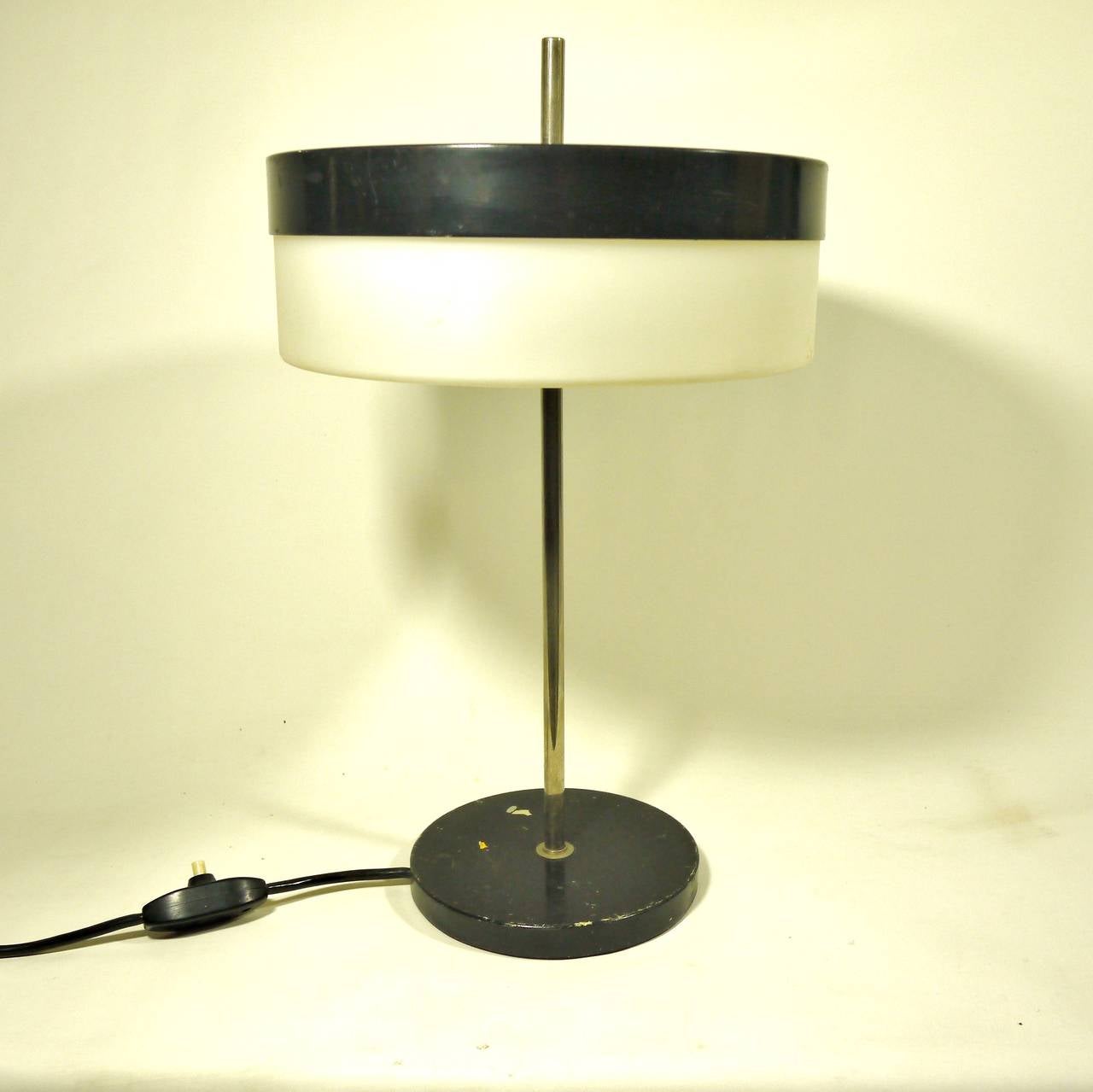 Desk or table lamp by Stilux Milano editor. Black laquered metal and perspex deflector.