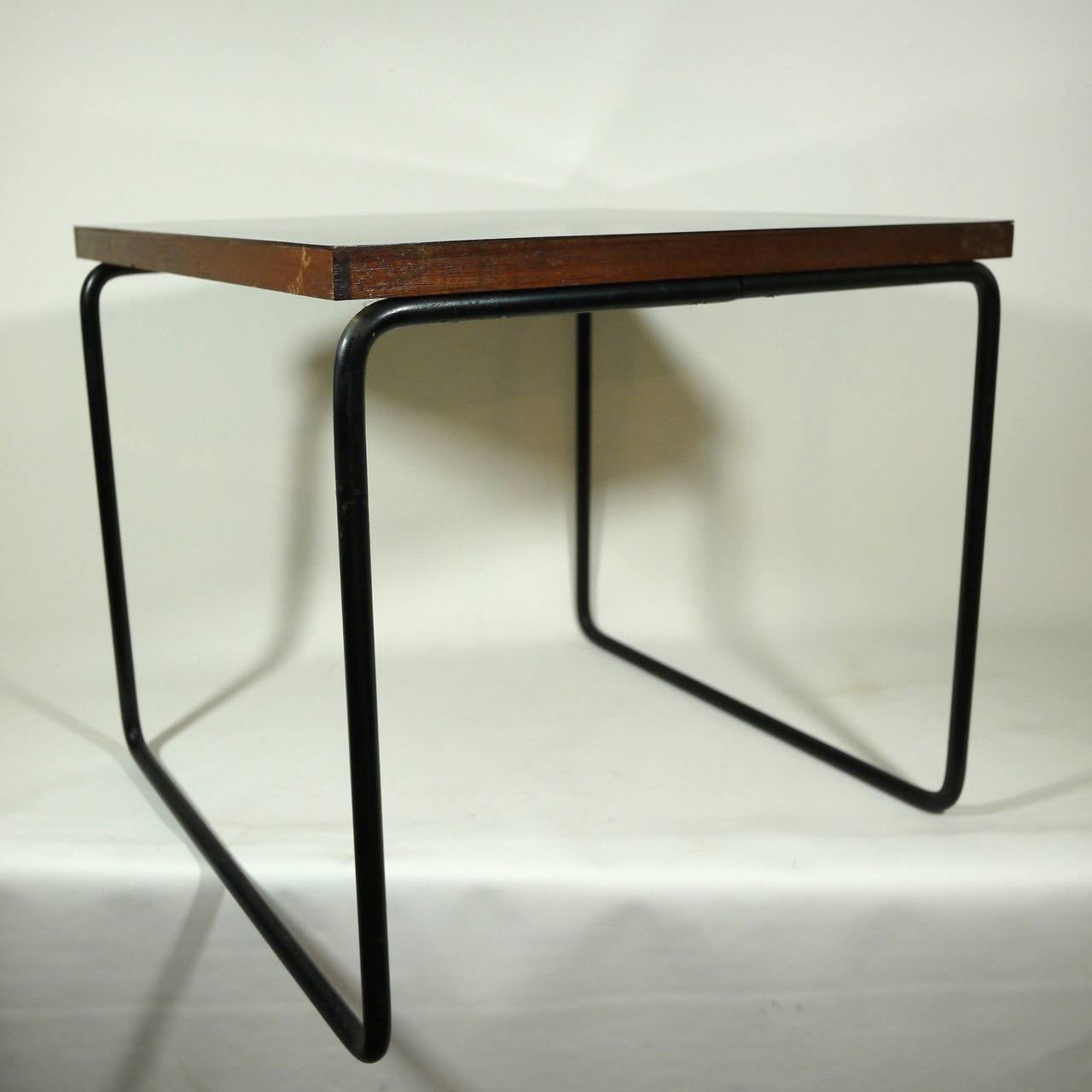 Side table by Pierre Guariche for Steiner Editor. Black laquered metal base with black plated wood top.