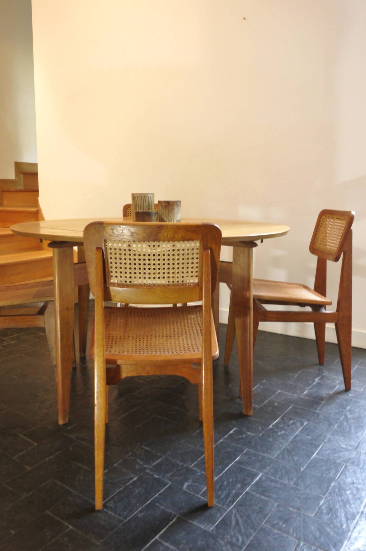 Rare set of four oak caned chairs, C model, by Marcel Gascoin for ARHEC editor in 1950.