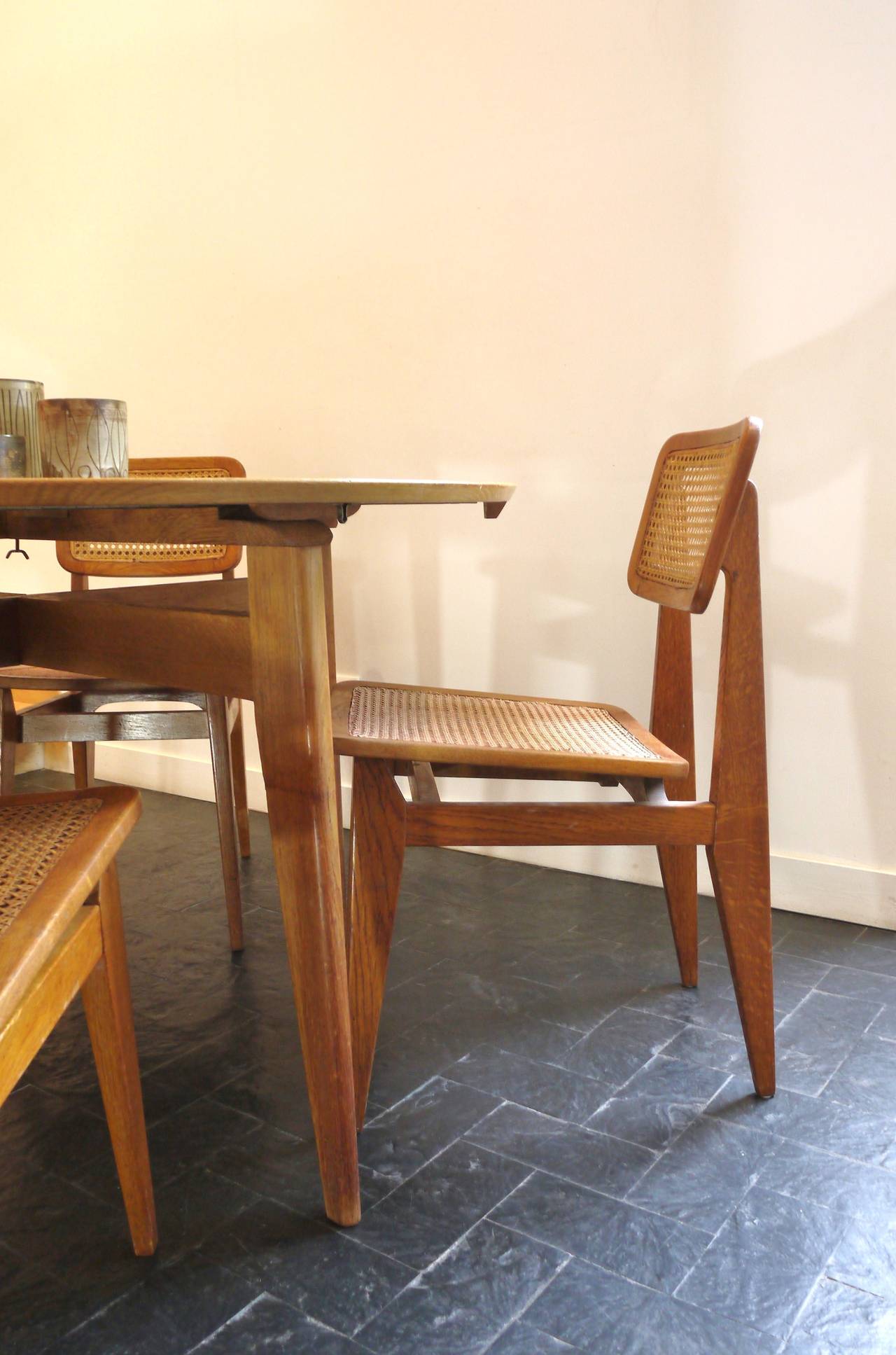 Set of Four Caned Chairs by Marcel Gascoin In Good Condition In POITIERS, FR