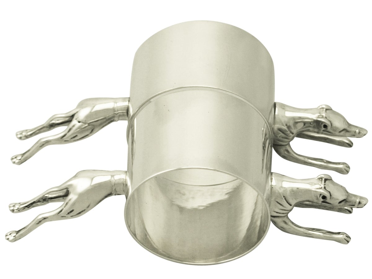 Pair of Sterling Silver and Electroplated Silver 'Greyhound' Napkin Rings