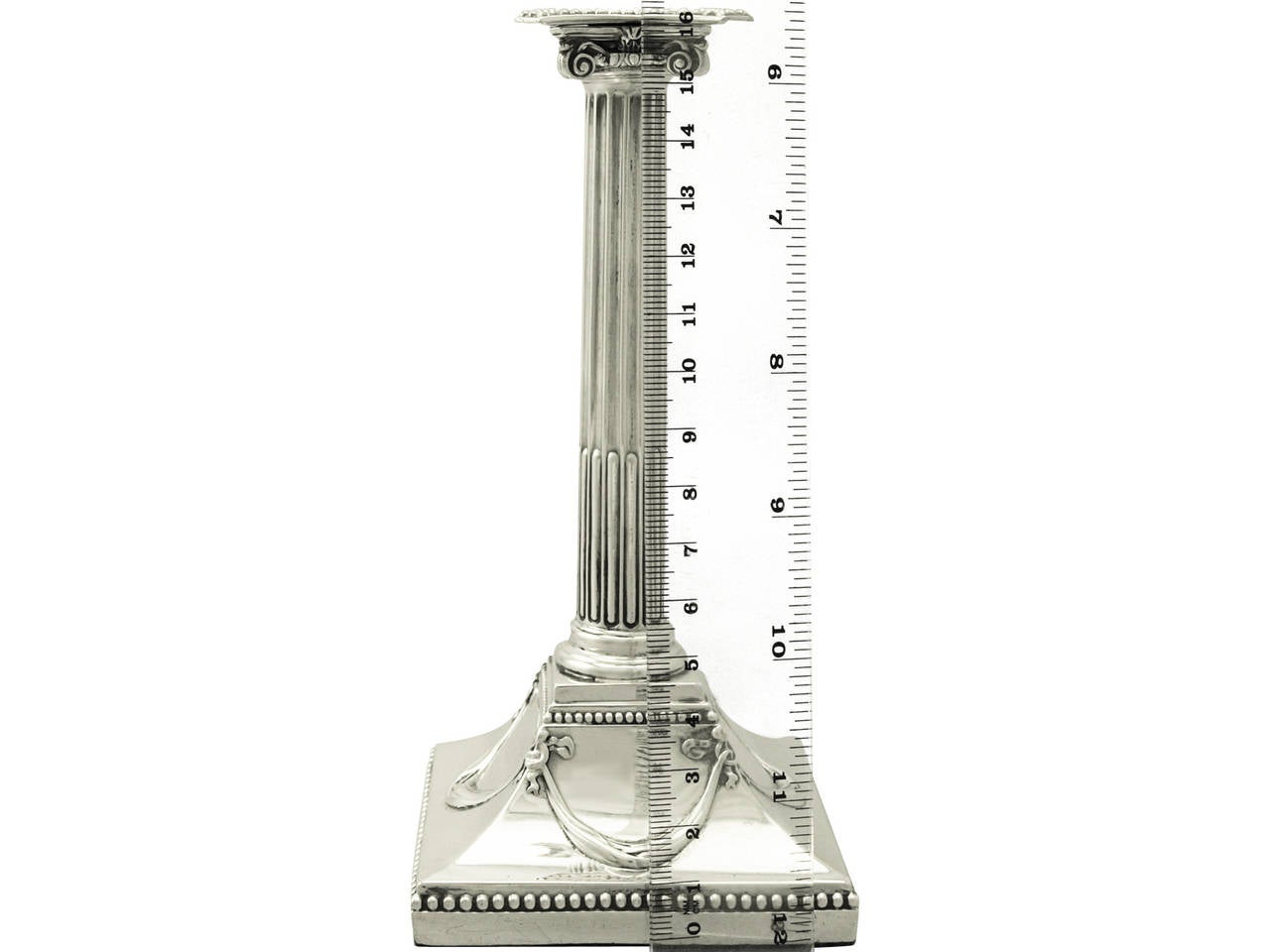 A fine and impressive antique George III English sterling silver Corinthian column taper candlestick; part of our ornamental Georgian silverware collection.

This fine antique George III sterling silver taper candlestick has an impressive