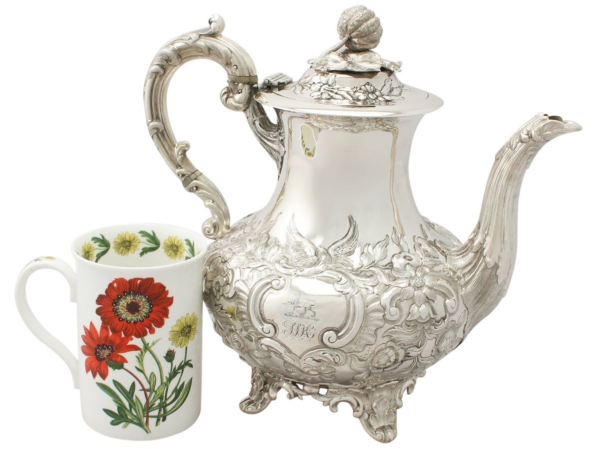 An exceptional, fine and impressive antique Victorian English sterling silver coffee pot; an addition to our silver teaware collection.

This exceptional antique sterling silver coffee pot has a baluster shaped form onto four bracket style