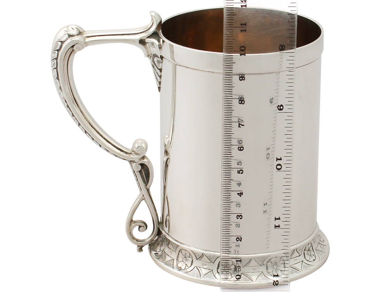 A fine and impressive antique English Victorian sterling silver christening mug; part of our silver christening collection.

This impressive antique Victorian sterling silver christening mug has a subtly tapering cylindrical form to a spreading