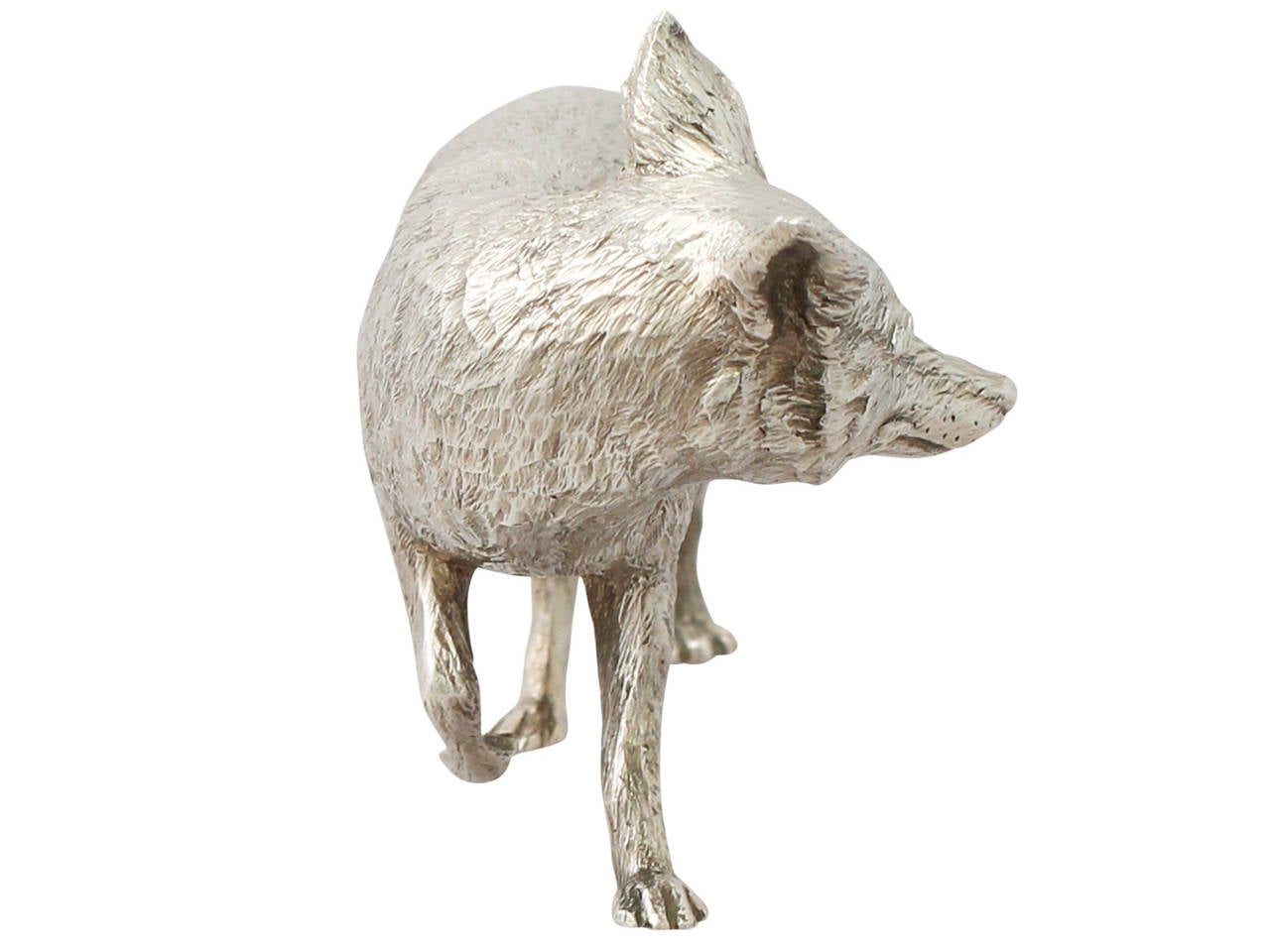 A fine contemporary English cast sterling silver model of a fox; part of our ornamental silverware collection.

This fine contemporary cast sterling silver ornament has been realistically modelled in the form of a fox regardant.

This piece has