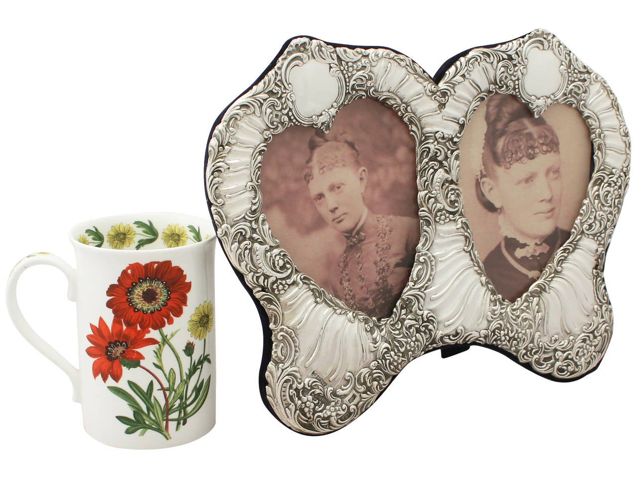 An exceptional, fine and impressive antique Victorian sterling silver double heart shaped photograph frame; an addition to our ornamental silverware collection.

This exceptional antique Victorian sterling silver photograph frame has a double