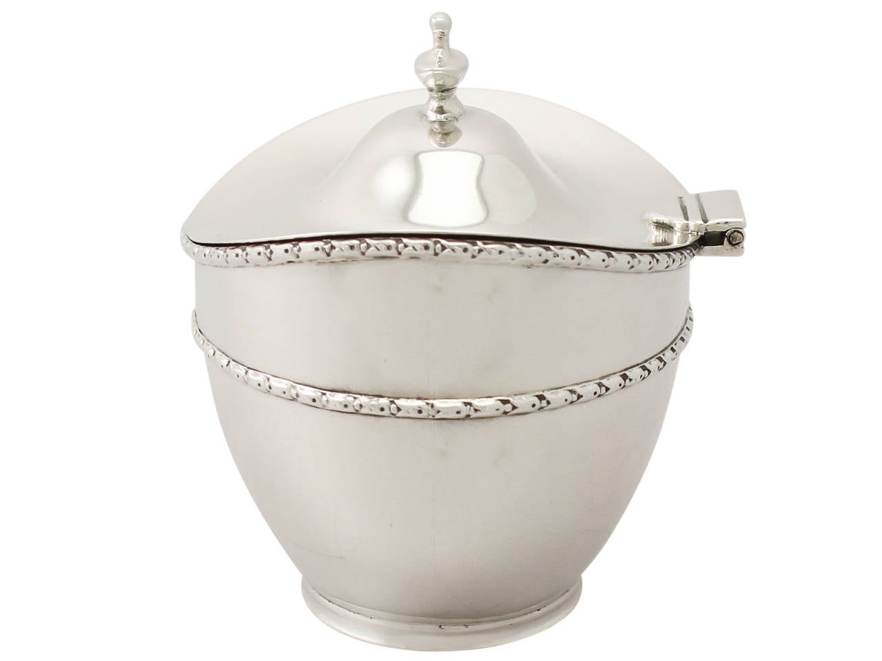 A fine and impressive antique George V English sterling silver tea caddy; part of our silver teaware collection

This impressive antique George V sterling silver tea caddy has a plain oval form onto a collet foot.


The surface of the caddy is plain