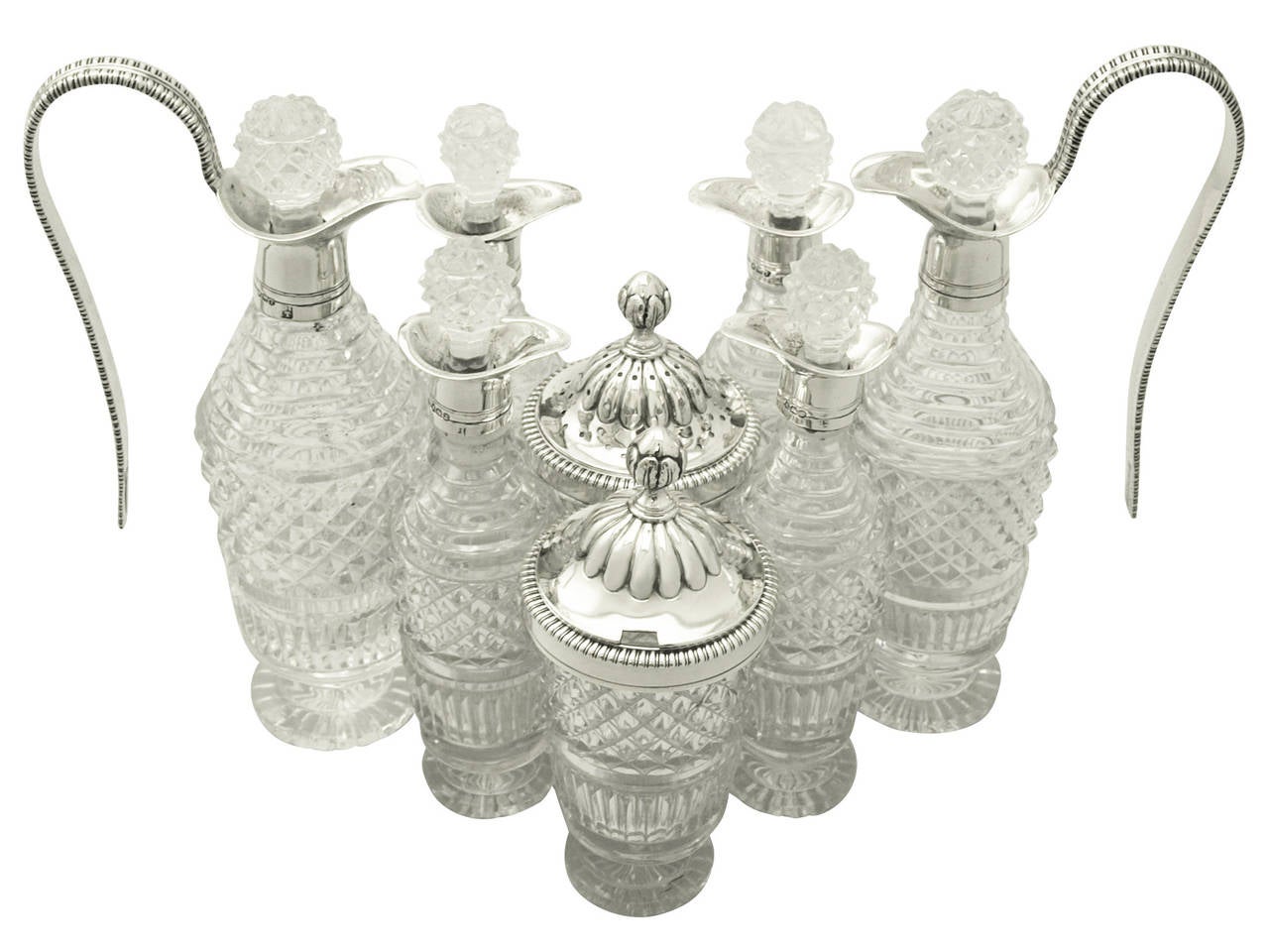 An exceptional, fine and impressive antique Georgian English sterling silver and cut-glass eight bottle table cruet set; an addition to our collectable dining silverware.

This exceptional antique George III cut-glass and sterling silver cruet set
