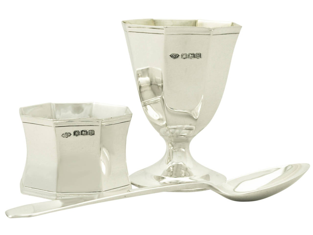 A fine antique George V English sterling silver three piece christening set in the Art Deco style - boxed; an addition to our christening silverware collection.

This fine antique George V sterling silver christening set consists of an egg cup, a