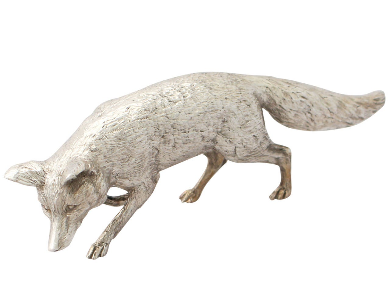 A fine contemporary English cast sterling silver model of a fox; part of our ornamental silverware collection.

This fine contemporary cast sterling silver ornament has been realistically modelled in the form of a fox.

This piece has been