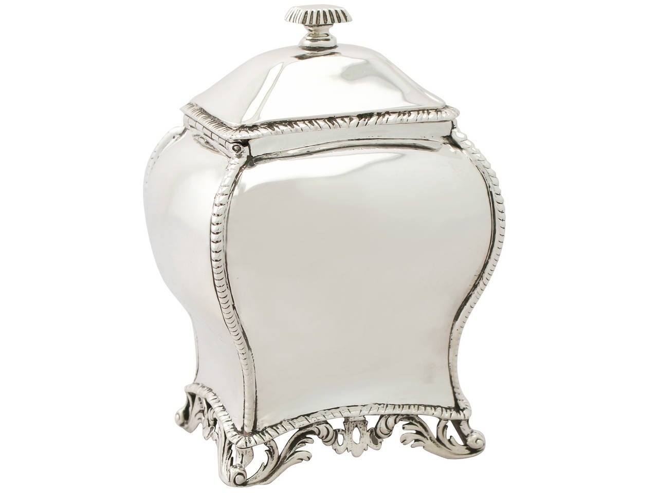 A fine and impressive, antique Georgian English sterling silver tea caddy in the Regency style; an addition to our silver teaware collection.

This fine antique George III sterling silver tea caddy has a plain Regency style bombe shaped