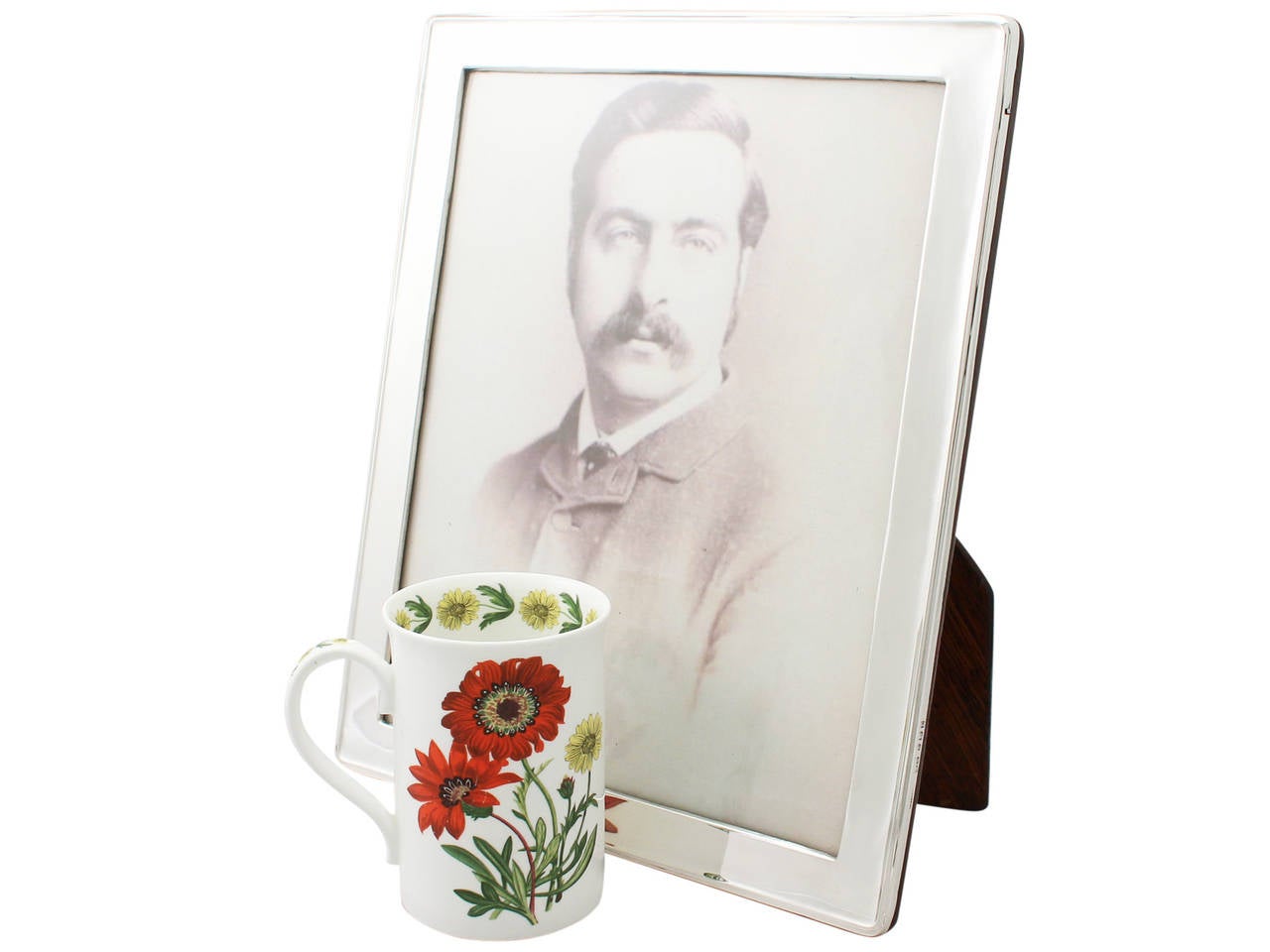 A fine and impressive antique George V English sterling silver photograph frame; an addition to our ornamental silverware collection.

This fine antique George V sterling silver photograph frame has a plain rectangular form with rounded