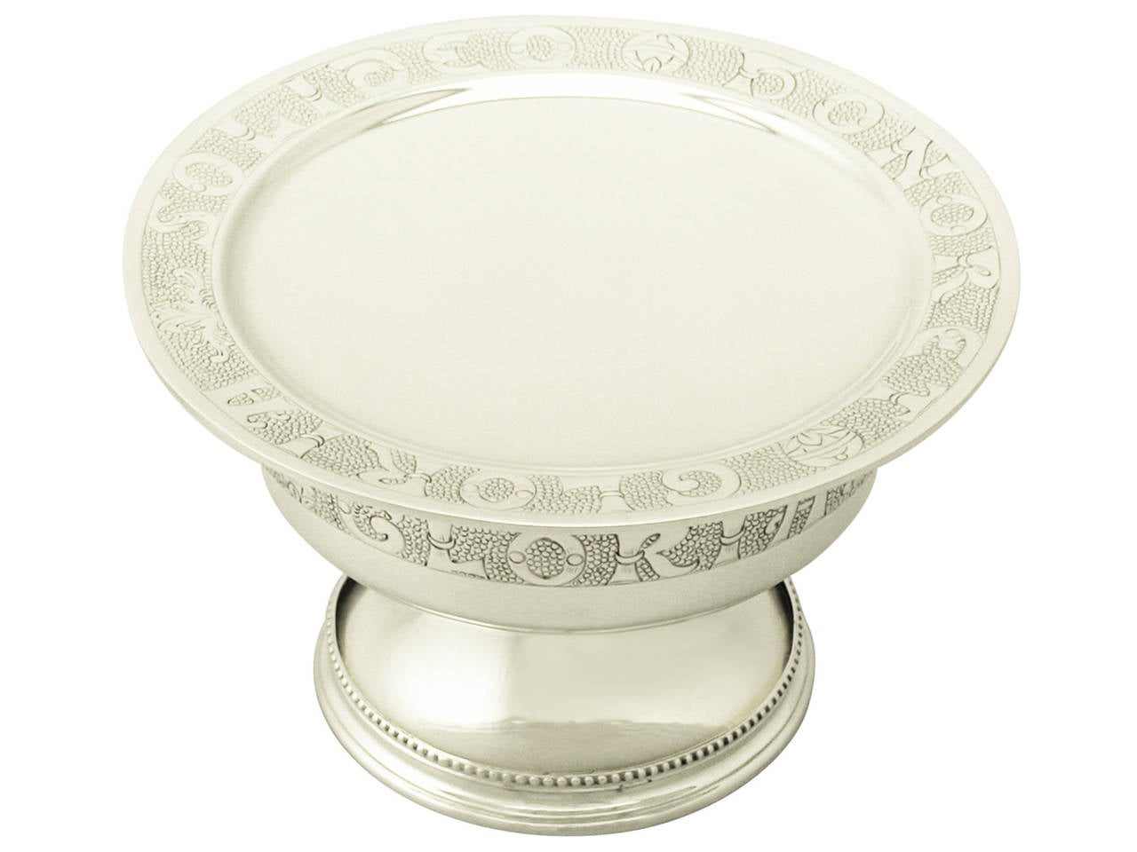 A fine and impressive antique George V English sterling silver chalice/pyx and paten; an addition to our diverse ecclesiastical silverware collection

This fine two piece antique George V sterling silver set consists of a chalice/pyx and