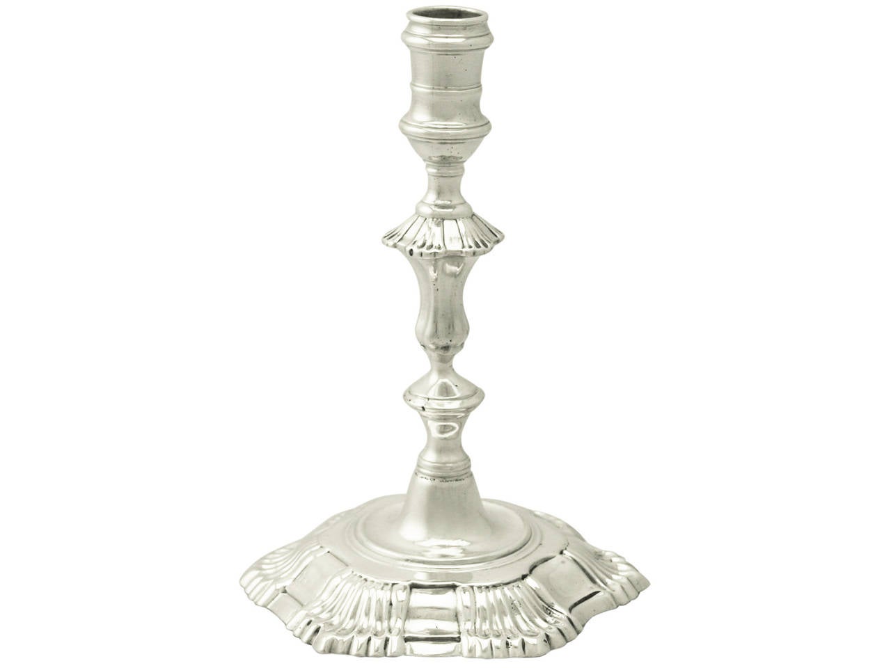 A fine and impressive antique Georgian English cast sterling silver taperstick by John Café; an addition of our ornamental silverware collection.

This fine antique George II cast sterling silver taperstick has a plain classical English
