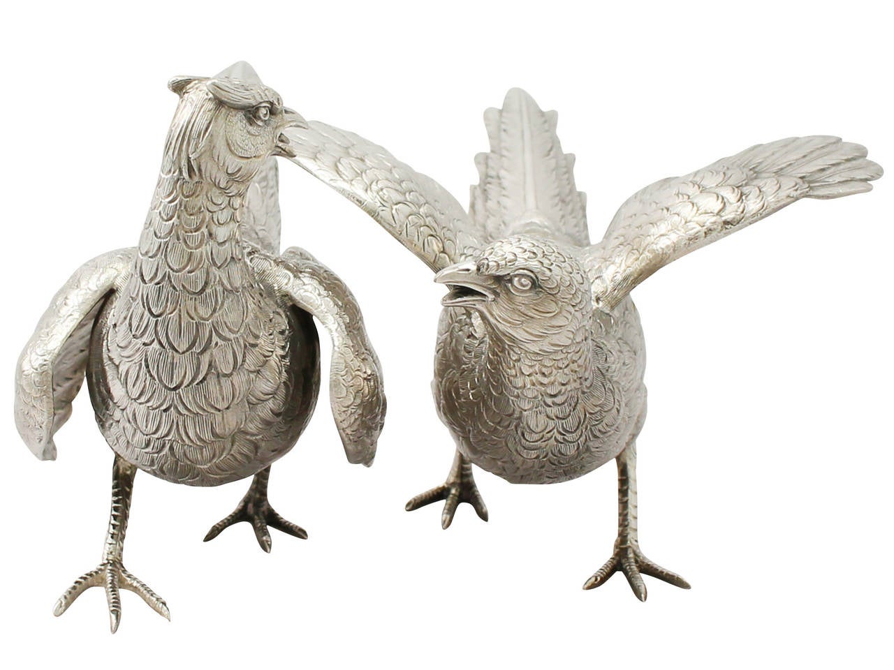 An exceptional, fine and impressive pair of vintage German sterling silver table pheasants in an antique style; part of our continental ornamental silverware collection

Description

These fine vintage German sterling silver table ornaments have
