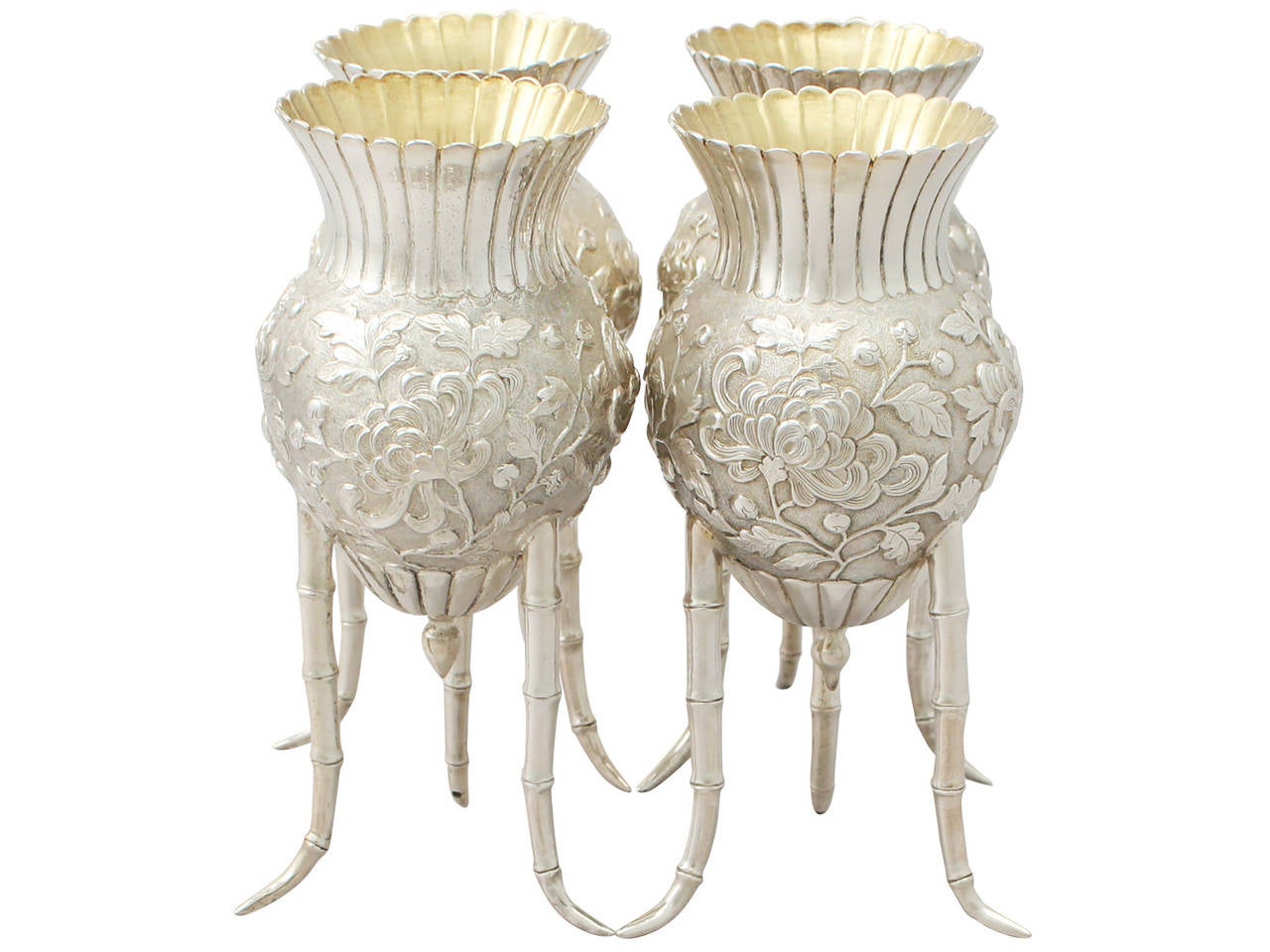 An exceptional, fine and impressive, unusual set of four antique Japanese silver vases; an addition to our antique Asian vase collection.

These exceptional Japanese antique silver vases have a gourd shaped form with a waisted fluted neck.

The body