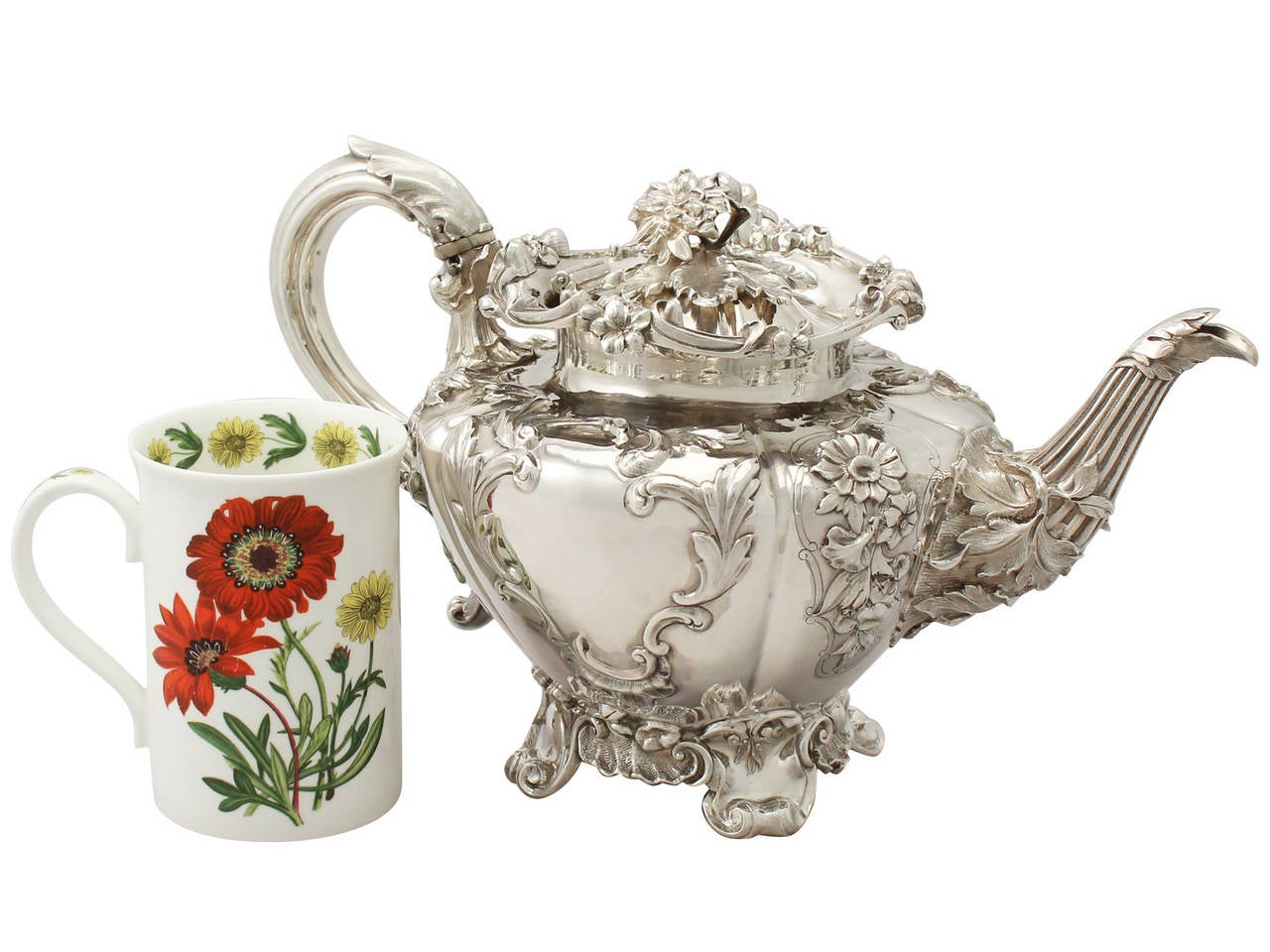 An exceptional, fine and impressive antique Victorian English sterling silver teapot; an addition to our silver teaware collection.

This exceptional antique Victorian sterling silver teapot has a compressed melon shaped form onto four bracket