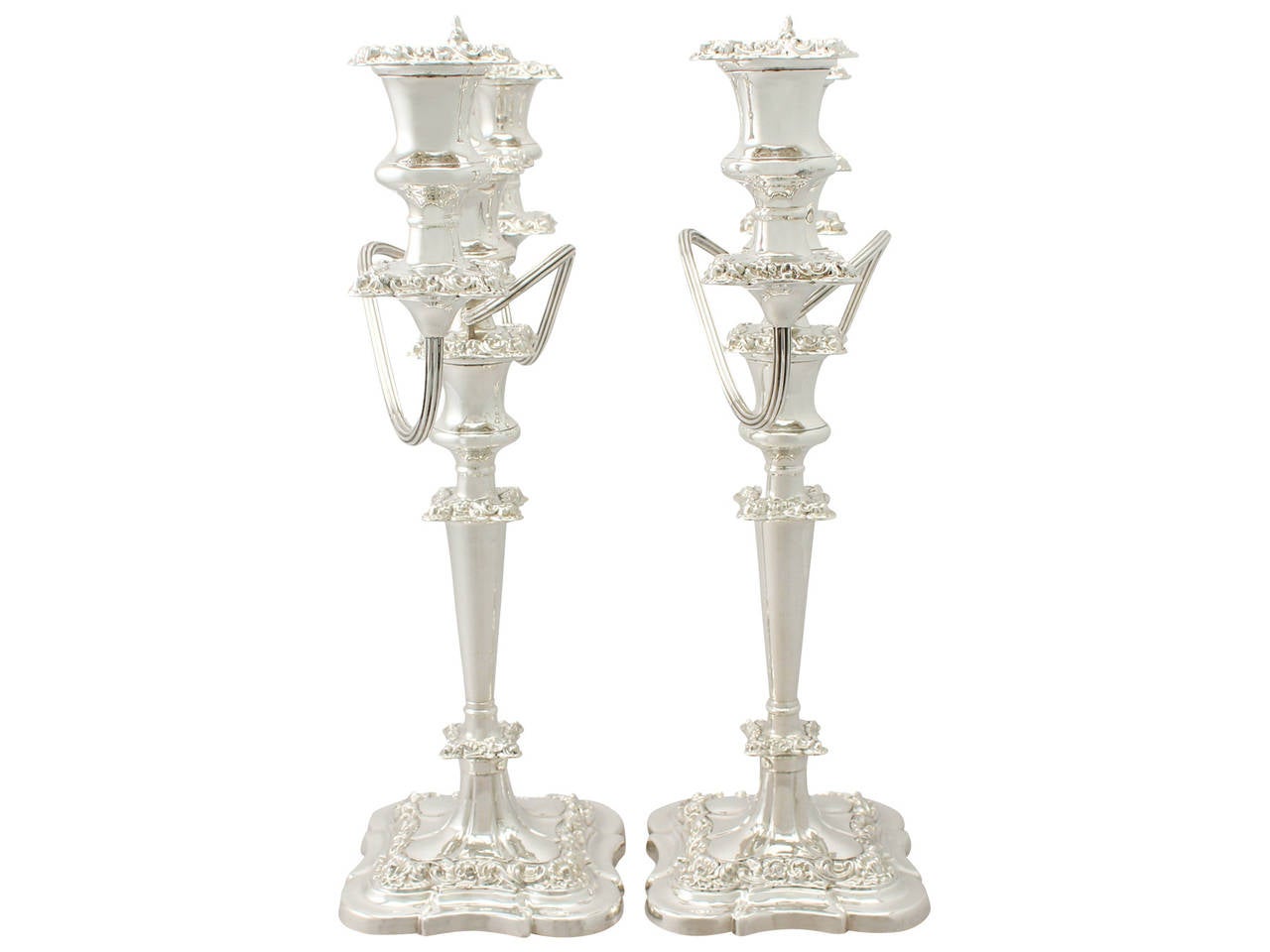 A fine and impressive pair of vintage Elizabeth II English sterling silver three light candelabra; an addition to our ornamental silverware collection.

These fine vintage Elizabeth II sterling silver three light candelabra have plain circular