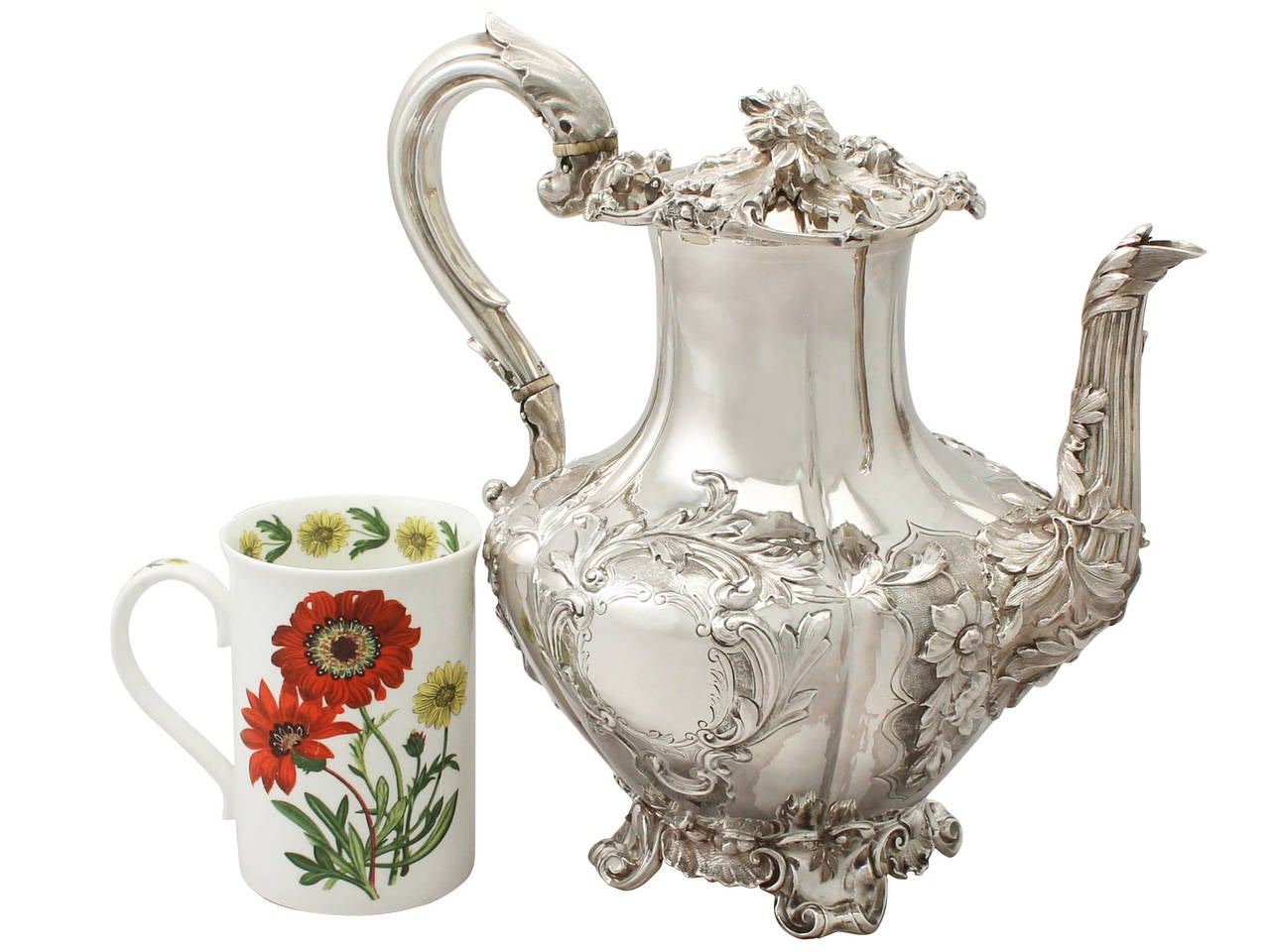An exceptional, fine and impressive antique Victorian English sterling silver coffee pot; an addition to our silver teaware collection.
This exceptional antique Victorian sterling silver coffee pot has a baluster, melon shaped form onto four