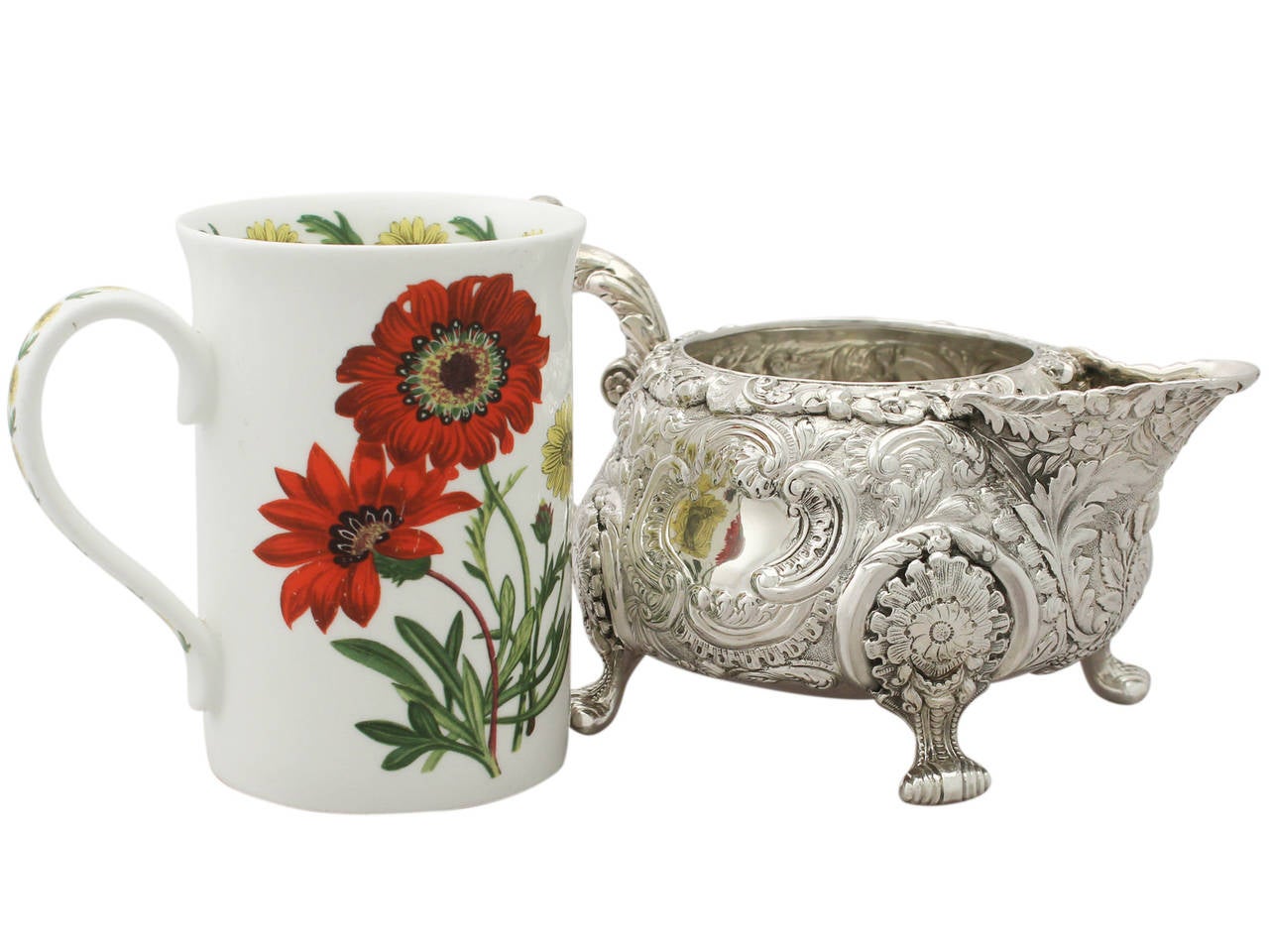 An exceptional, fine and impressive antique George IV English sterling silver creamer; part of our silver teaware collection.
This exceptional antique George IV sterling silver cream jug has a circular rounded compressed form.
The body is