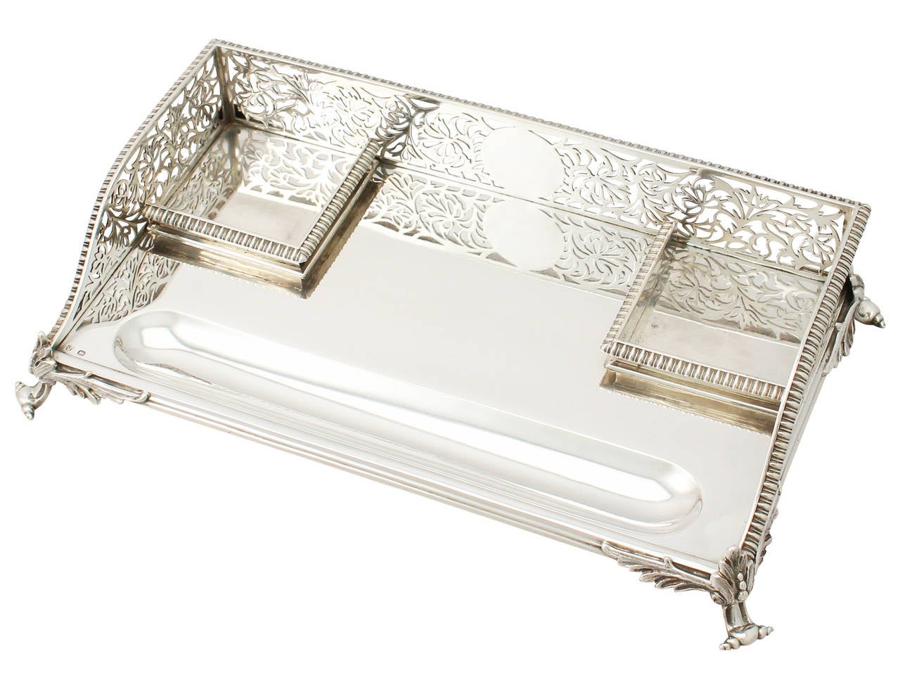 A fine and impressive antique Victorian English sterling silver and cut glass gallery desk standish; an addition to our ornamental office silverware collection.
This fine antique Victorian sterling silver gallery desk standish has a rectangular