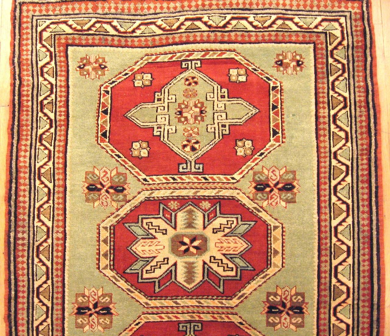 Hand-Knotted Antique Caucasian Kazak Oriental Rug, in Small Squarish Size w/ Green Background For Sale