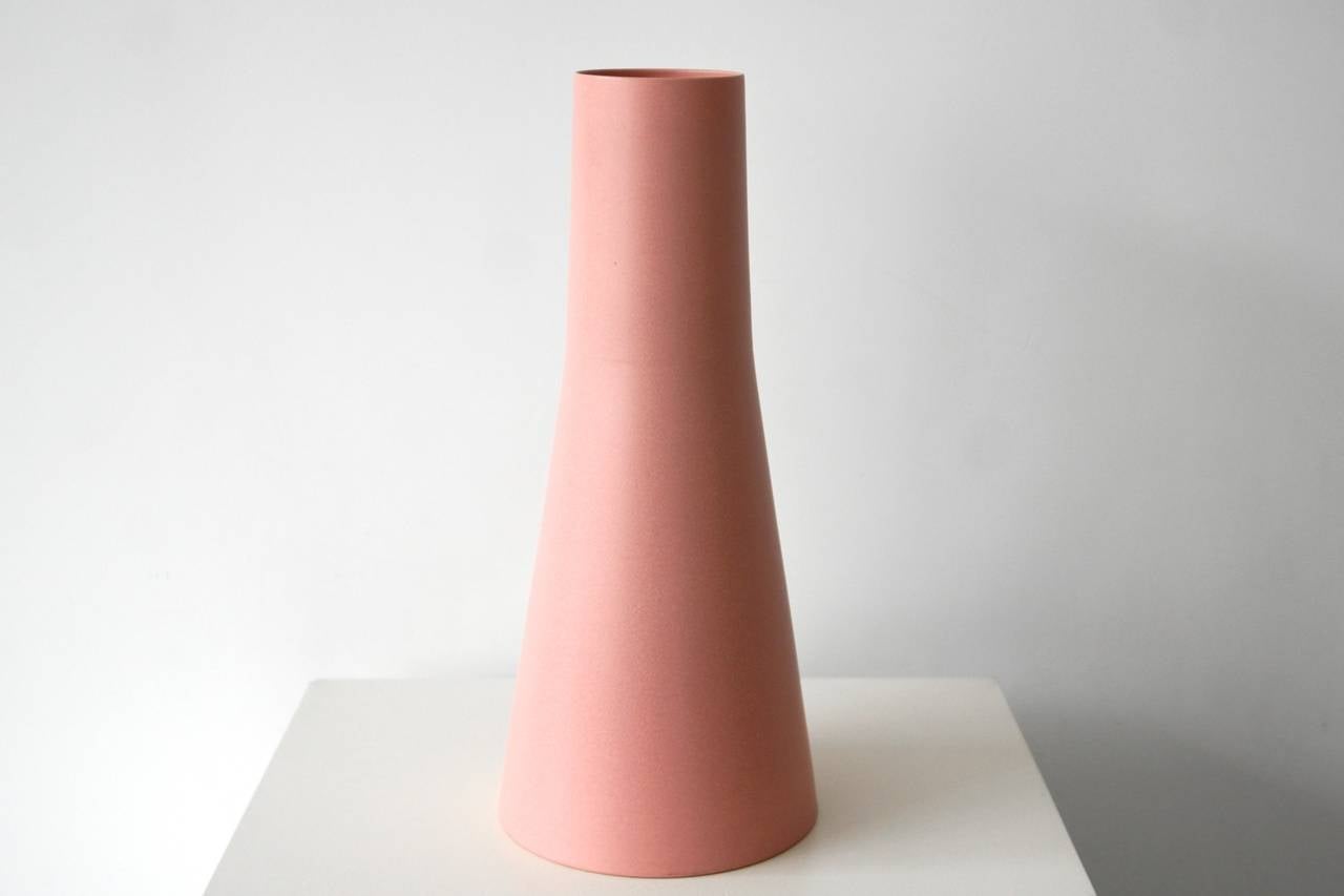 Thrown form, formed of two parts.
First a layer of pink engobe was put on the surface.
Then sprayed with glaze in the same color. The effect is the,
Intensity of the color.