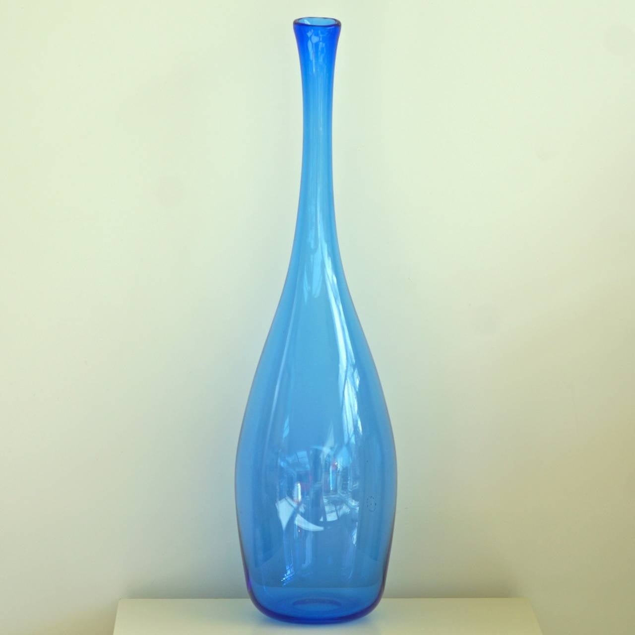 Vase of blue glass, made at the Glassworks Leerdam in Leerdam, after a design,
by Floris Meydam, who is known for his glassdesigns from the 1950s and,
the 1960s. Signed and dated with a yearcode LL=1961.