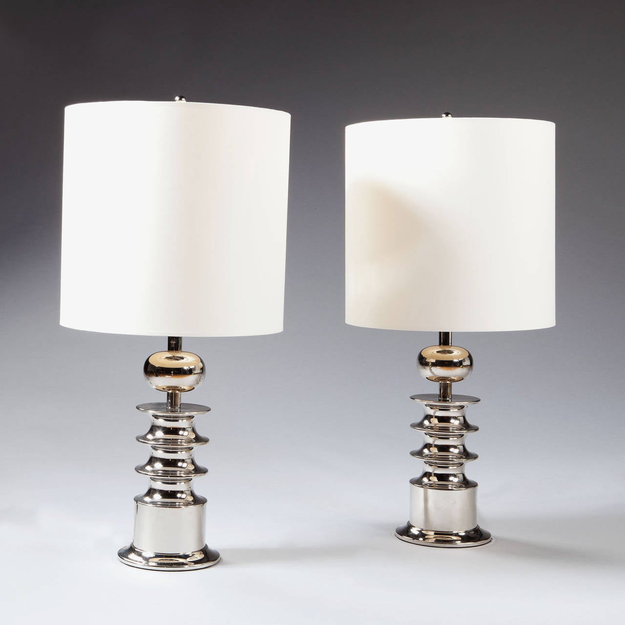 A pair of Mid-Century Italian nickel-plated geometric column lamps.

Possibly by Arredoluce or Sergio Asti, stamped AC and 