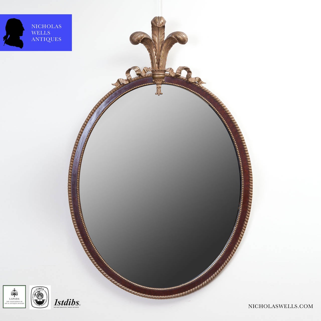 A fine late 19th century oval mirror with gilt rope twist motif and surmounted with gilt Prince of Wales feathers.