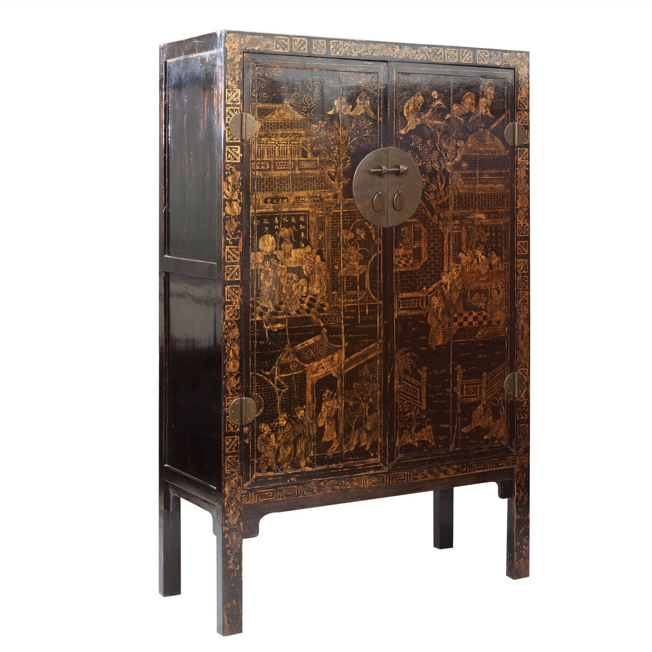 A fine pair of large-scale Chinese export black lacquer cabinets decorated with gilt chinoiseries. Each with double doors opening to shelves and drawers, and raised on square legs.