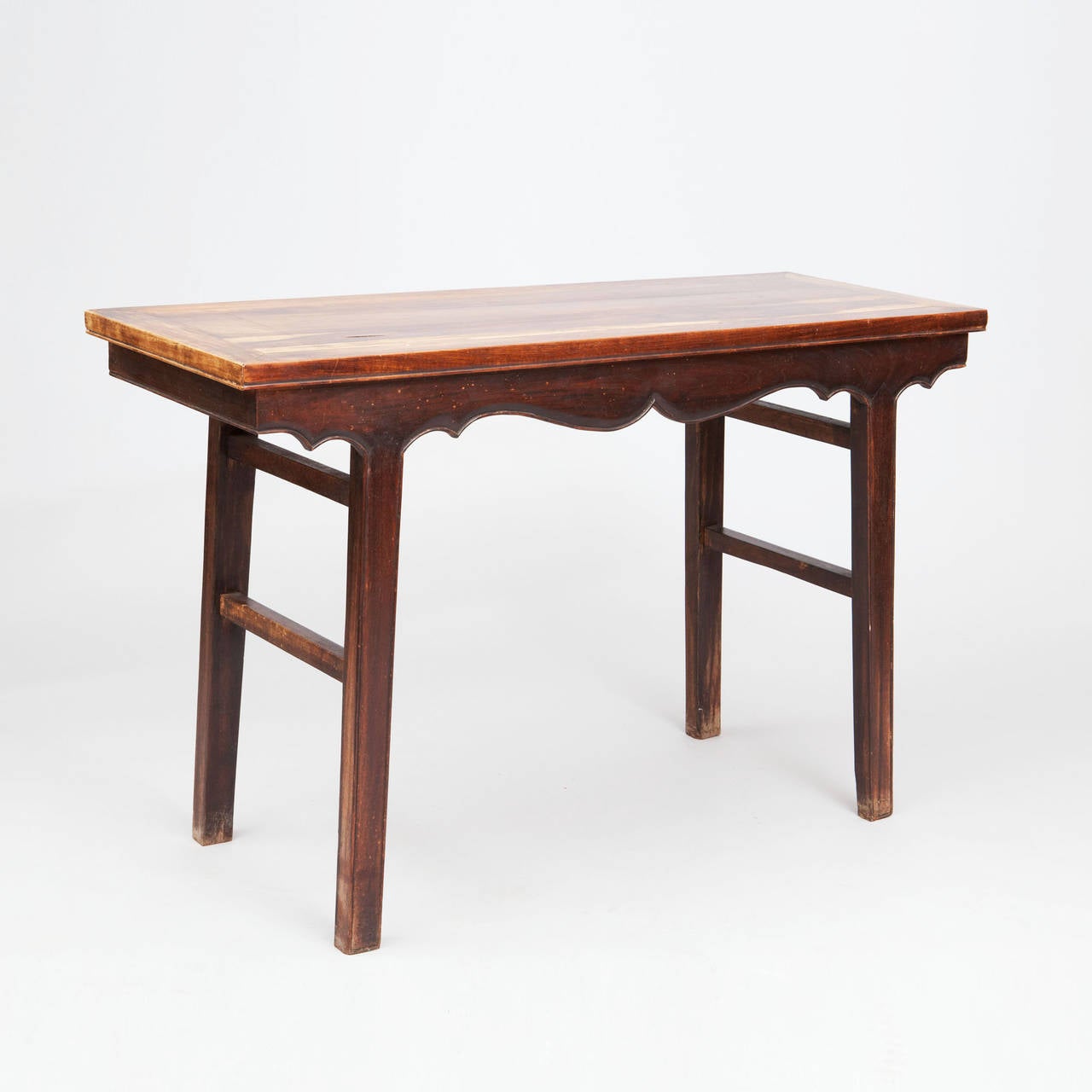 A fine 19th century Chinese hardwood altar table, the rectangular top with scalloped shell apron on both sides, raised on square canted legs and stretchers.