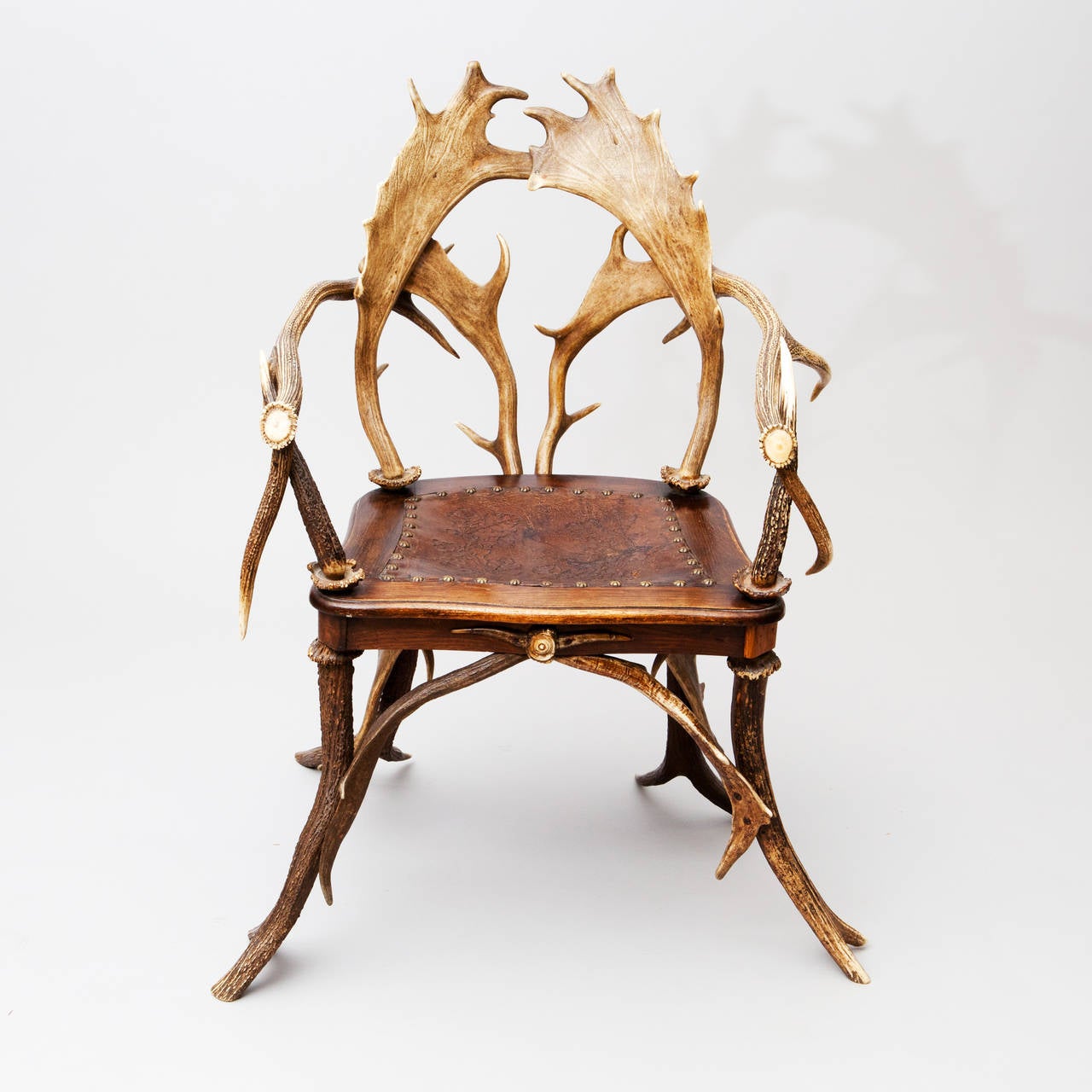 This superb antique Blackforest armchair is crafted from Red Stag and Fallow Deer Antlers. This is one of the original chairs of this design which are still made today. The smoothed surface and patina of this chair are very attractive and it is