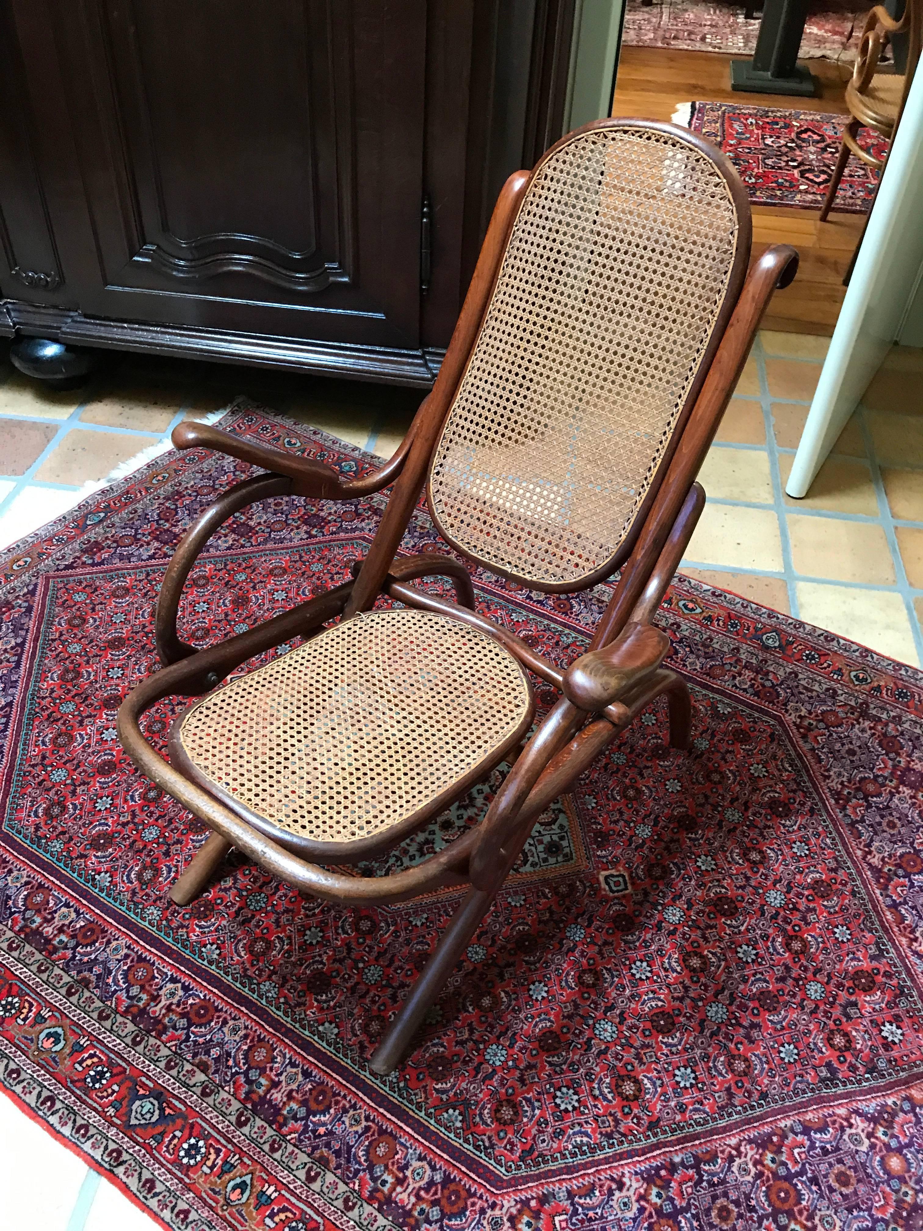 Oldest form of an easy armchair
folding chair of Thonet nr 1 
Rare oldest form and first stamp by Thonet, 1867
Kaminsessel
Measures: 75 x 64 x 98 x 42.
 