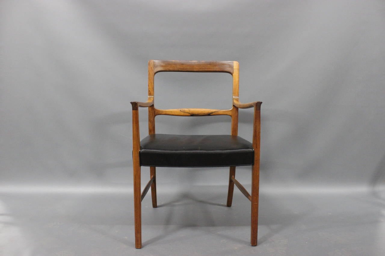 A very rare rosewood armchair  designed by Ole Wanscher in 1954. Made by cabinetmaker A.J.Iversen.
With original Black leather.