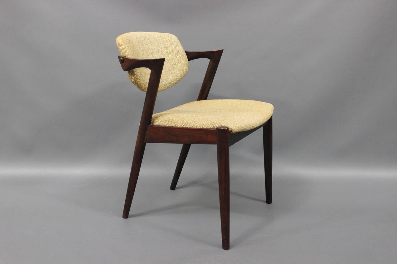 Set of 6 chairs by Kai Kristiansen Model 42 in rosewood. The chairs are with a swivel back and can ajust to the back which makes it very comfortable. The chairs are in there original condition with use.