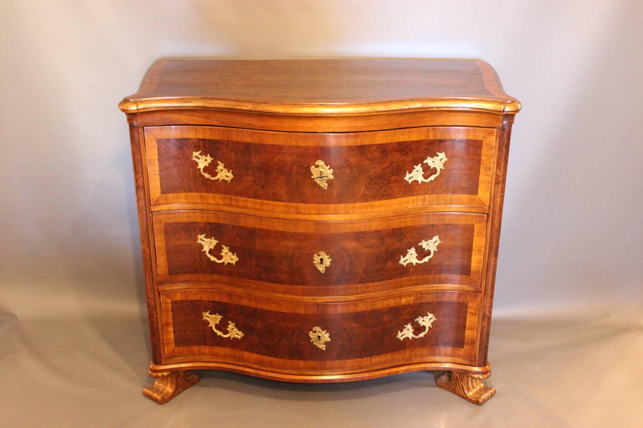 This beautiful chest of drawers is from the year 1740. It is made by a cabinetmaker from Denmark. It is hand polished, and the wood is walnut. The chest is in great vintage condition. 