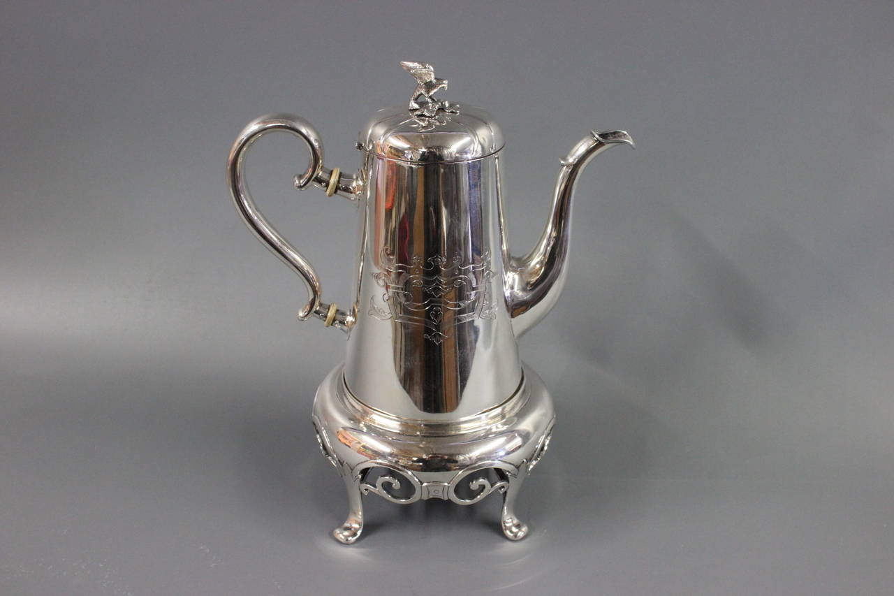 Unique Anton Michelsen Silver Coffee pot. Monogram A.M. Manufactured in the year 1854. With a heating silver bowl underneath. Made for heating with oil. The total weight is 1.325gr.