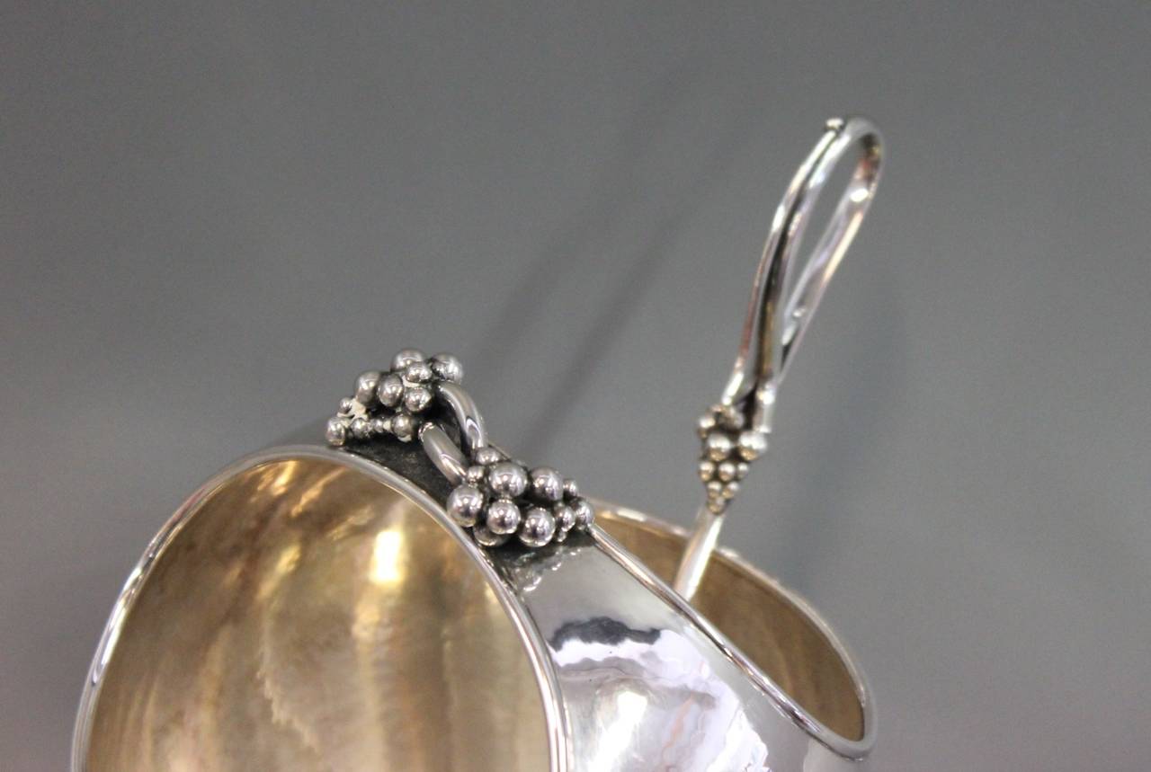 Silver Ice Bowl with spoon. Stamped 835s and decorated with grapes. Manufactured c.1940 by an unknown silversmith.
Total weight Bowl 371gr & Spoon 61gr.