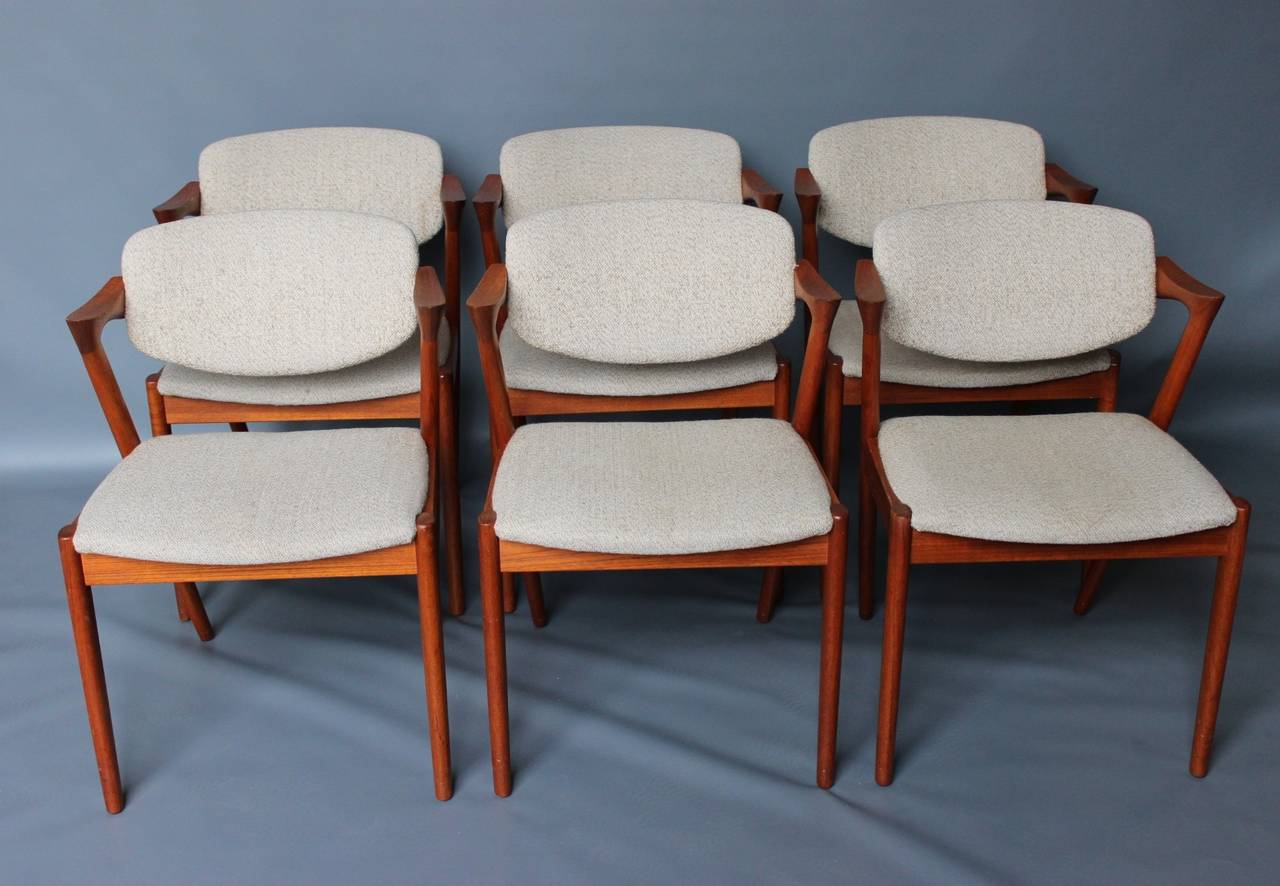 Set of six chairs by Kai Kristiansen model 42 in teak. The chairs are with a swivel back and can adjust to the back which makes it very comfortable. The chairs are in their original condition with a minor sign of use.