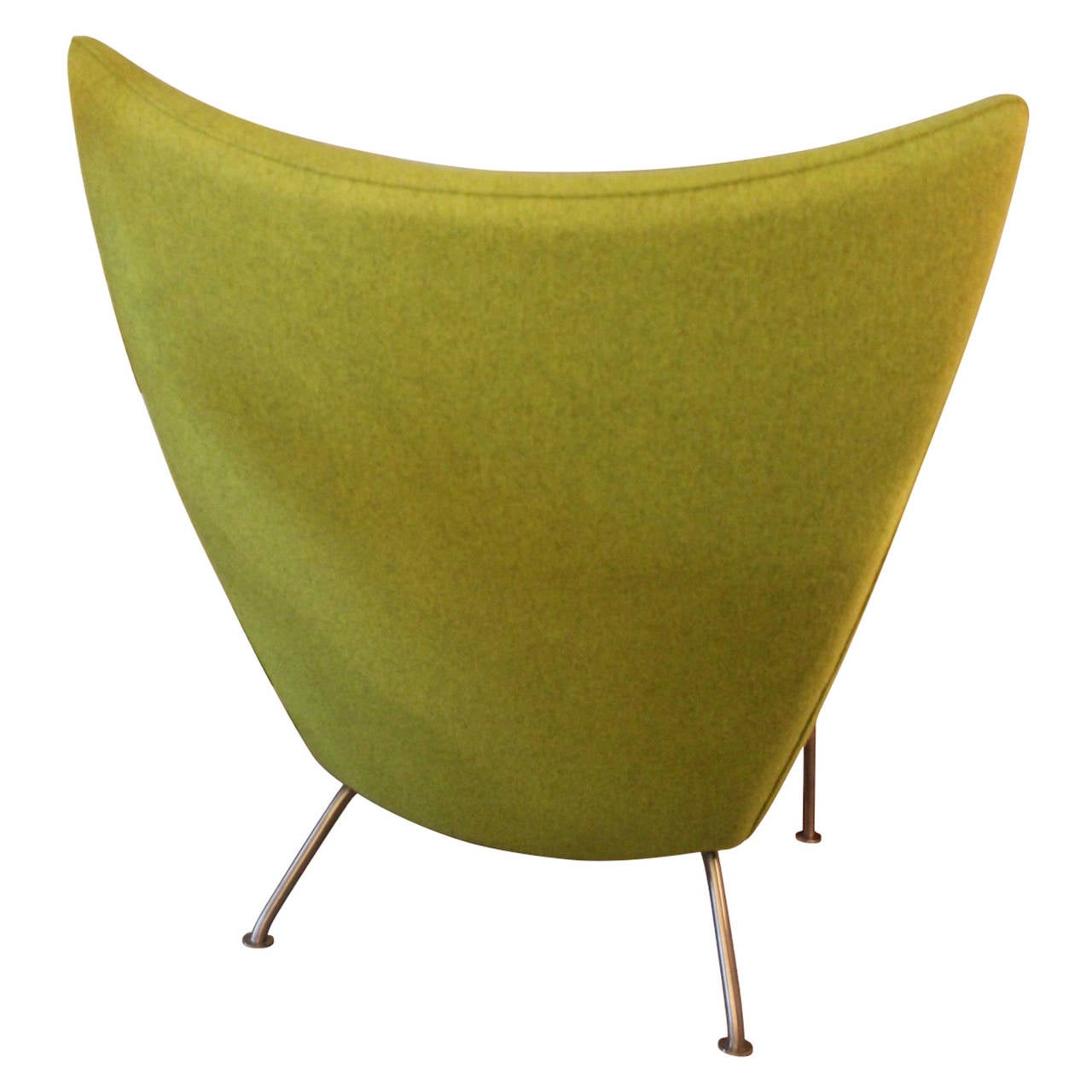 Hans J. Wegner Lounge Chair model 445. Design from 1960 and manufactured around 1990. Appears as new in apple-green colored wool.
