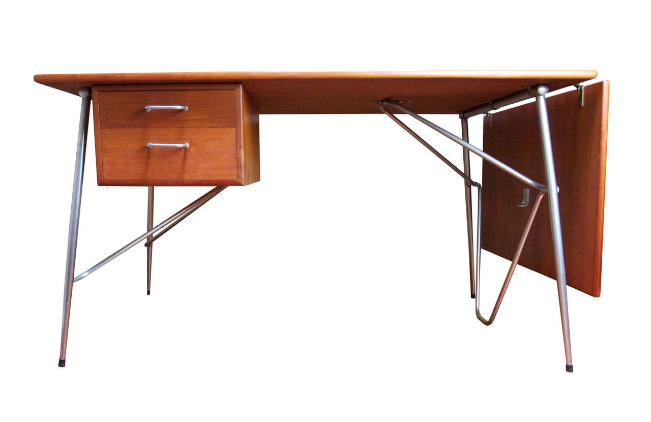 Danish Modernism at it's best - incredible design - lovely dovetailed drawers - this beauty looks great from every angle -extend when needed and drop down leaf for everyday use, this beauty is in very good condition - Makers mark on