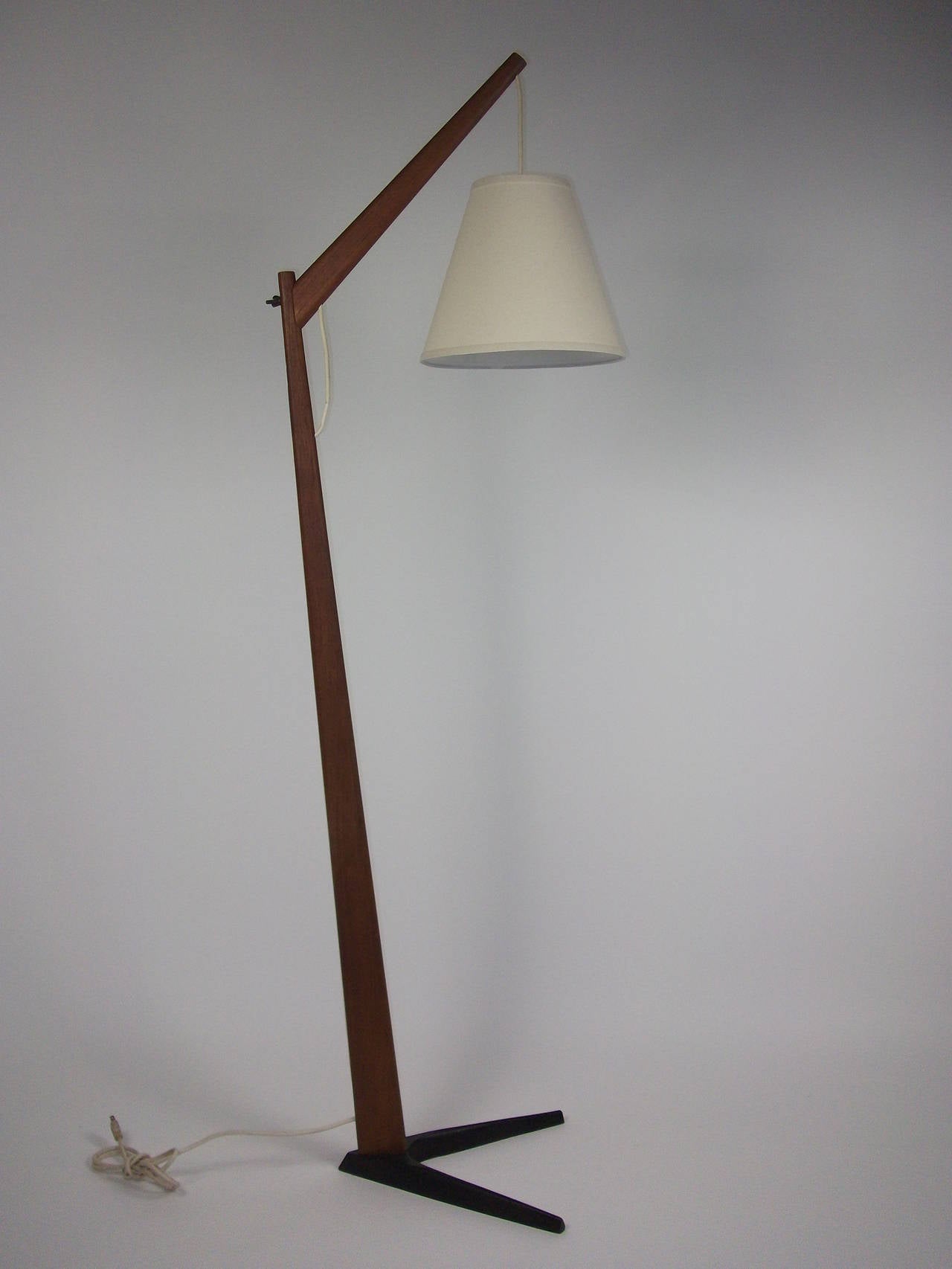 Incredible Danish floor lamp - fantastic combination of teak and cast iron, super sturdy, comes with a new custom shade.