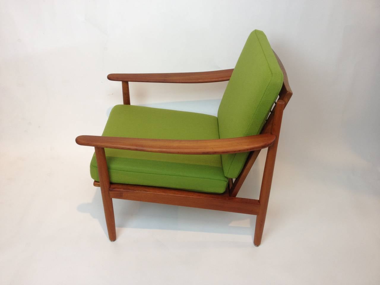 Gorgeous teak easy chair with sprung seats and backrest, all new foam and newly upholstered in 100% Maharam wool.  Very good condition.  Made by Danish company Fabian in the 1960s.