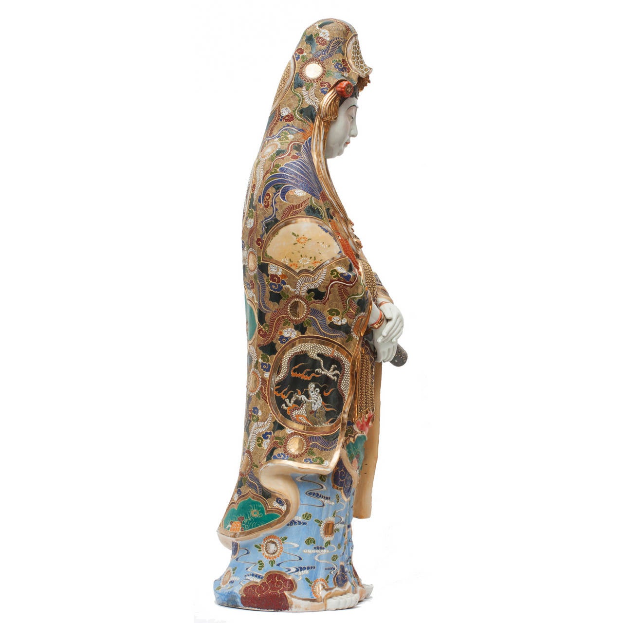A stunning and dramatic Kutani statue of the Bodhisattva Kannon, measuring almost three feet in height. This statue presents some of Kutani's finest craftsmanship with exceptional hand-painted detail covering the entire surface.

Made for the