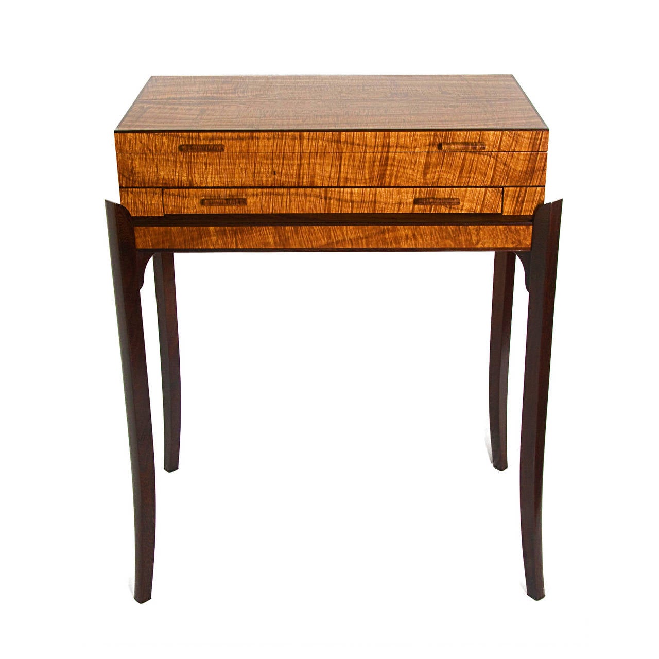 Contemporary chest and stand for storing cigars, displaying jewelry or other small collectors items. The chest is made of curly koa with pheasant wood (senna siamea) trim and legs. The inside of the chest is lined with fragrant Port Orford