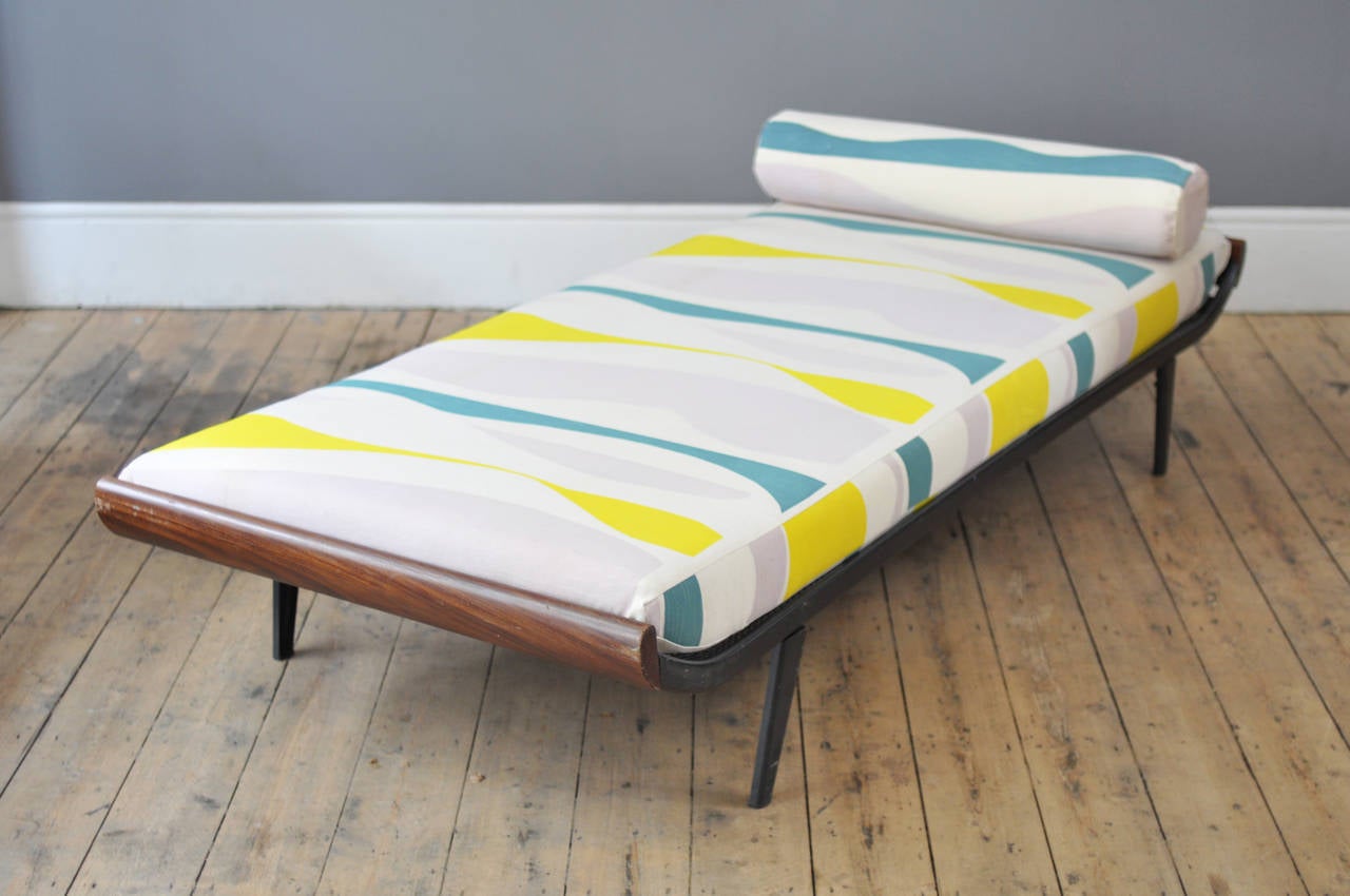 Beautifully minimalist 'Cleopatra' daybed by A. R. Cordemeijer for Auping with subtle mid century touches and elegantly curving lines.

New mattress and bolster, reupholstered in an exclusive fabric from the collaboration between London based