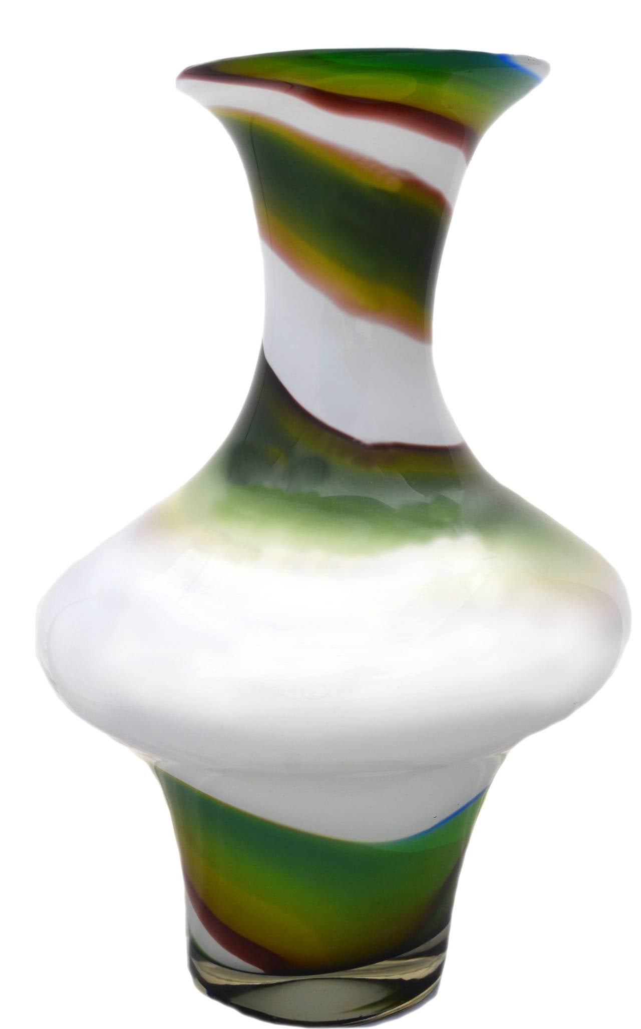 Stunning white and green swirl art glass vase with modern feel. Brown edge on green swirl adds to a sophisticated organic aesthetic; beautiful from all angles. circa. 2000. Excellent condition. No scratches or chips. Unknown artist. Size: 16