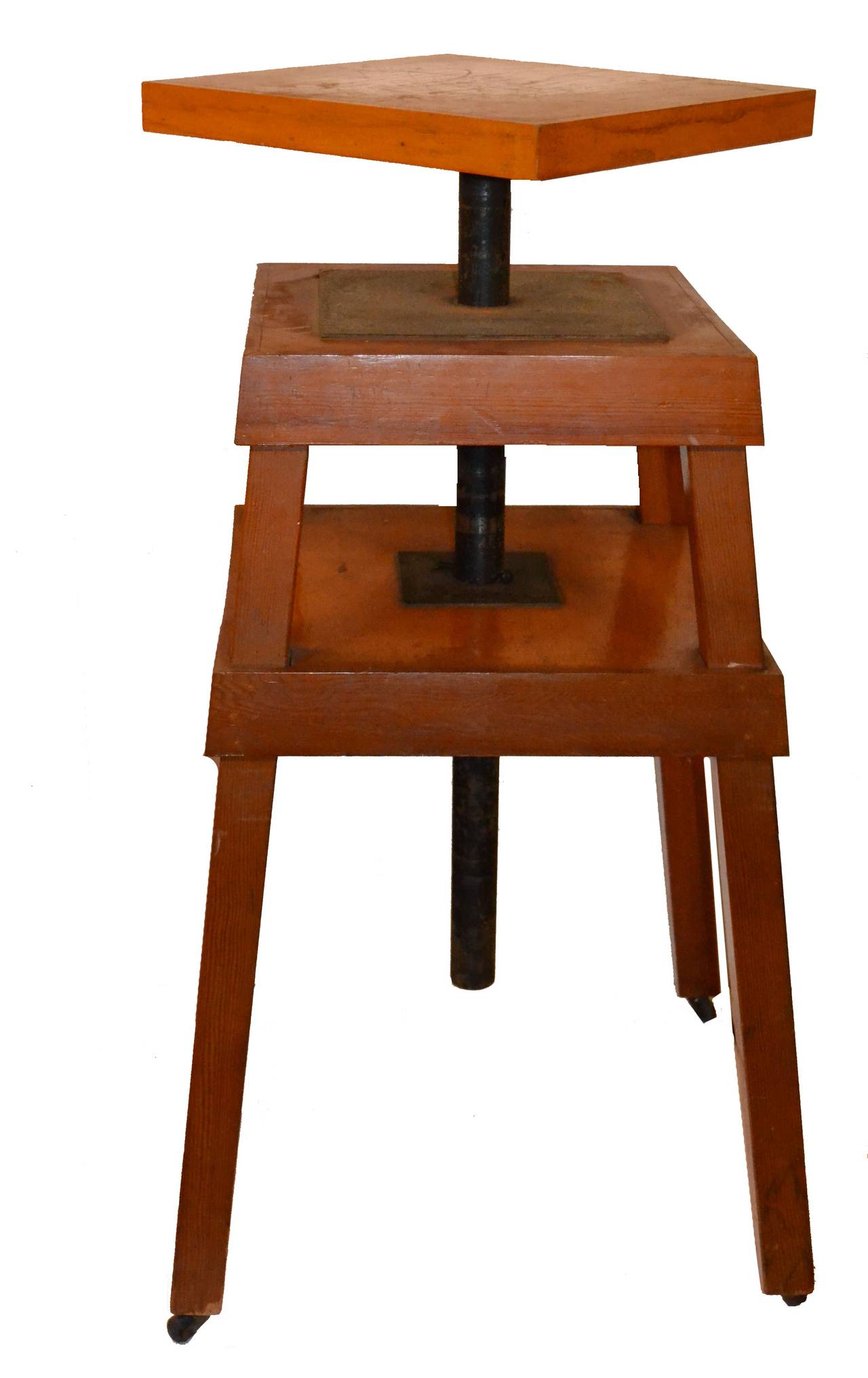 Purchased as part of an estate of a listed stone sculptor, this substantial Mid-Century sculptor's stand is fully adjustable and rotating and beautiful in its functional strength and simplicity. Heavy duty, this stand and its matching tool cart is