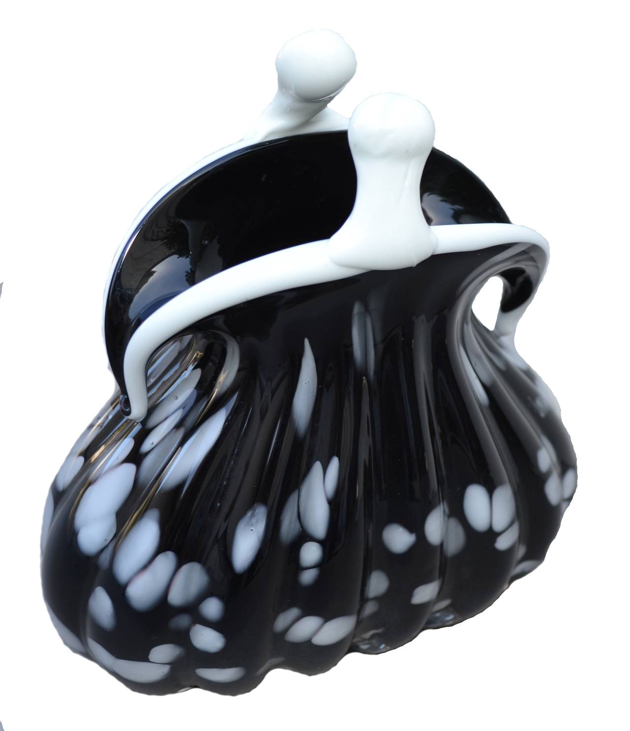 Charming and modern at the same time, this vintage Murano handblown glass coin purse is expertly formed with two well-defined layers of black with white dots surrounding the outside. On the underside the pontil has been cleanly ground and polished